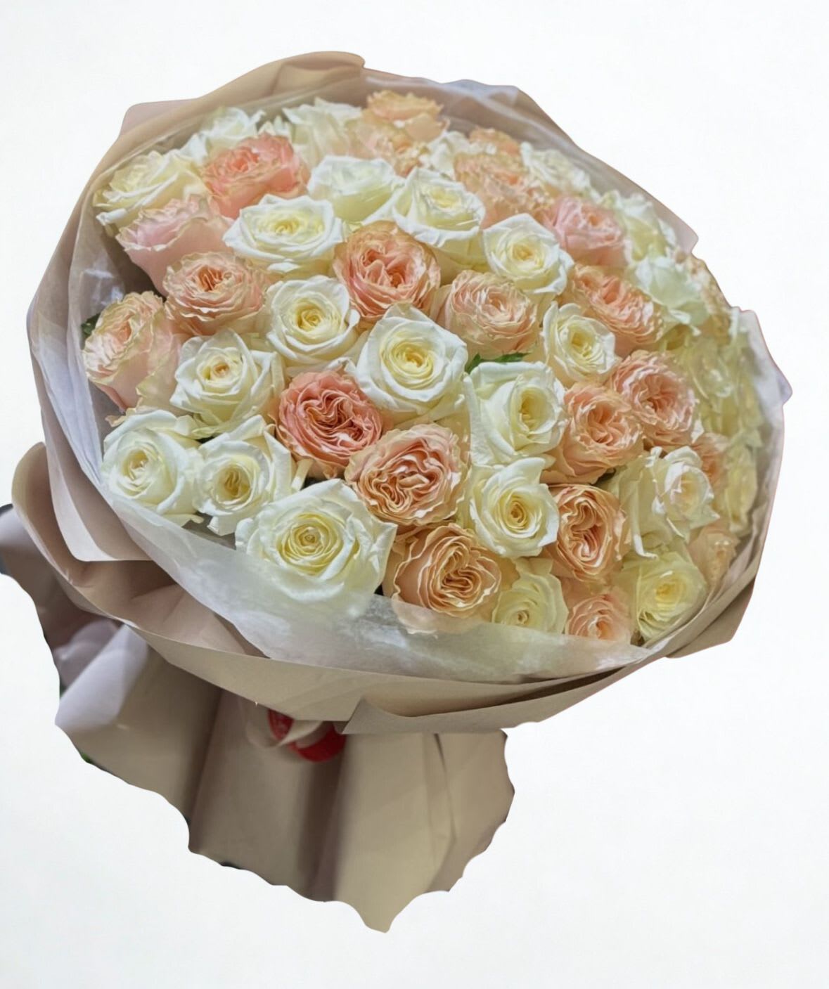 Ivory Rose cloud 50 roses - Fifty premium roses in a soft ivory + blush champagne mix  lush, romantic, and seriously WOW in person. This is a statement bouquet for anniversaries, birthdays, proposals, or when you need to make a big impression. Wrapped in neutral luxury paper for a clean, modern finish. Includes: 50 roses + premium wrapping Note: Rose shades may vary slightly based on availability, but the vibe stays the same.