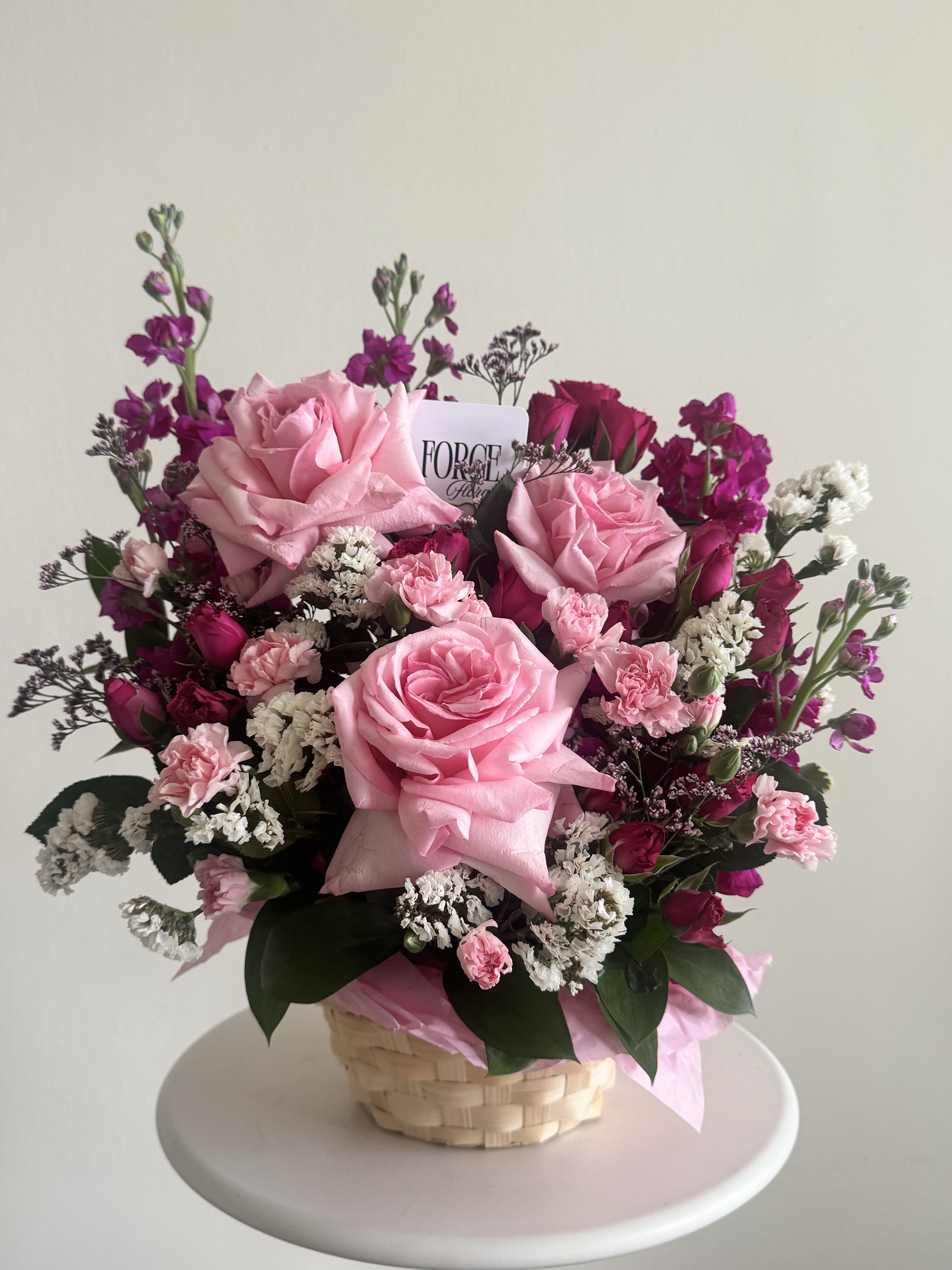 Fairy tale flower basket  - Mix of pink flowers in a basket 