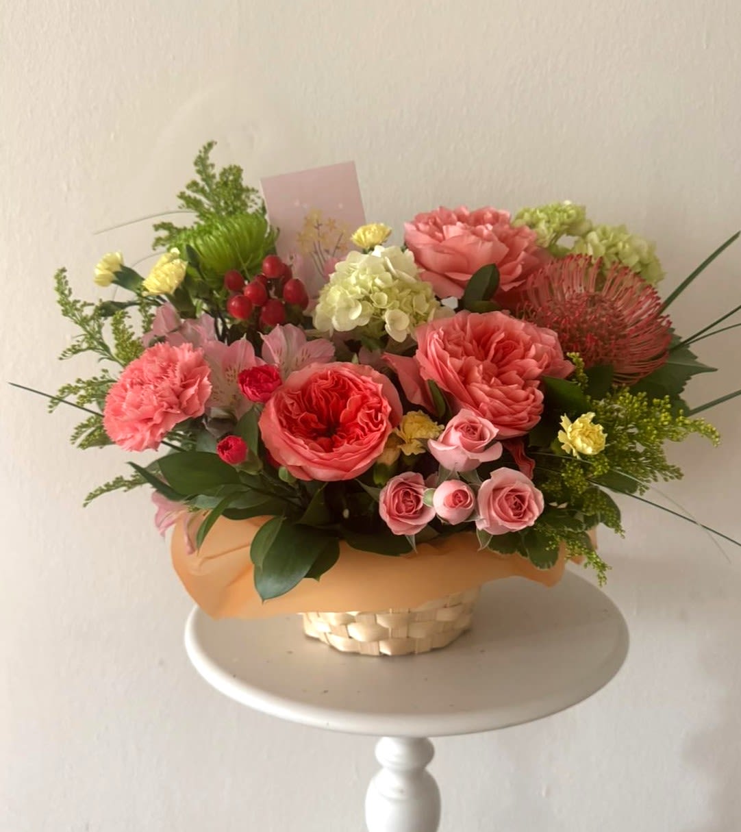 Coral Glow basket -Garden rose, Chrysanthemum, Solidago, Hydrangea.  - Bright mx of flowers in a basket. Garden rose, Chrysanthemum, Solidago, Hydrangea. 