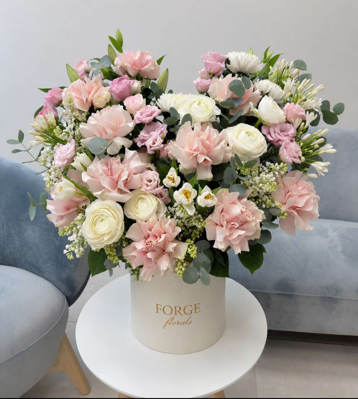 Pink and white mixed bouquet in a cream hat box