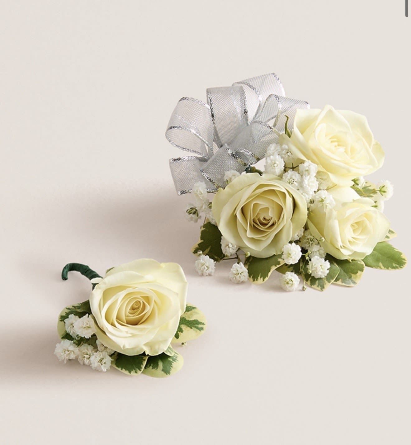 Corsage &amp; Boutonniere (Silver Bow) - This elegant corsage and boutonniere set is thoughtfully designed to pair perfectly, creating a polished and harmonious look for any special occasion. Each piece features carefully selected blooms and accents, offering a timeless and refined touch that complements your ensemble beautifully.