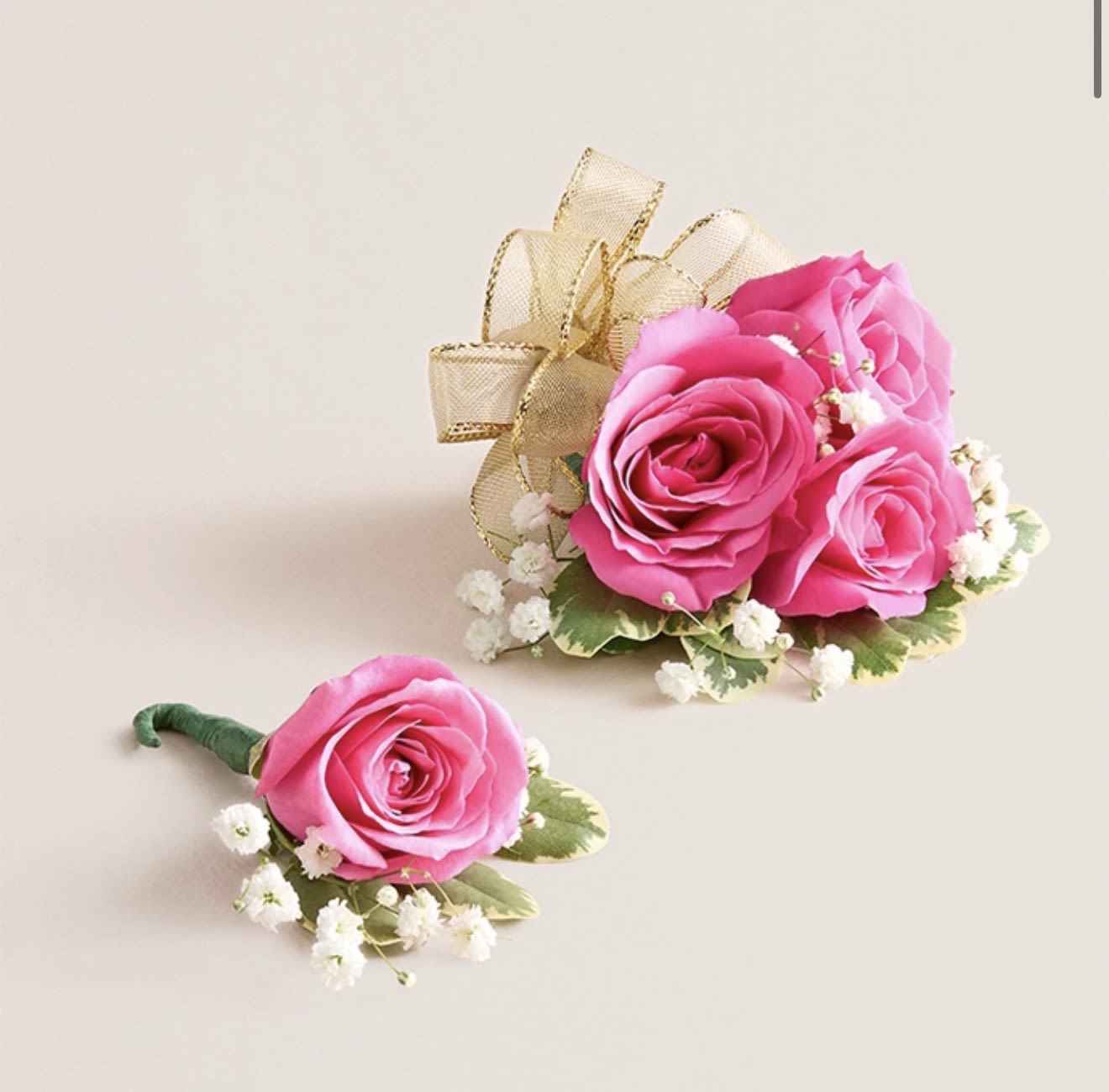 Hot Pink Corsage and Boutonniere Set (Gold Bow) - This striking corsage and boutonniere set, featuring bold hot pink blooms, is thoughtfully designed to pair perfectly, creating a polished and harmonious look for any special occasion. Each piece showcases carefully selected hot pink flowers and accents, offering a vibrant and refined touch that complements your ensemble beautifully.