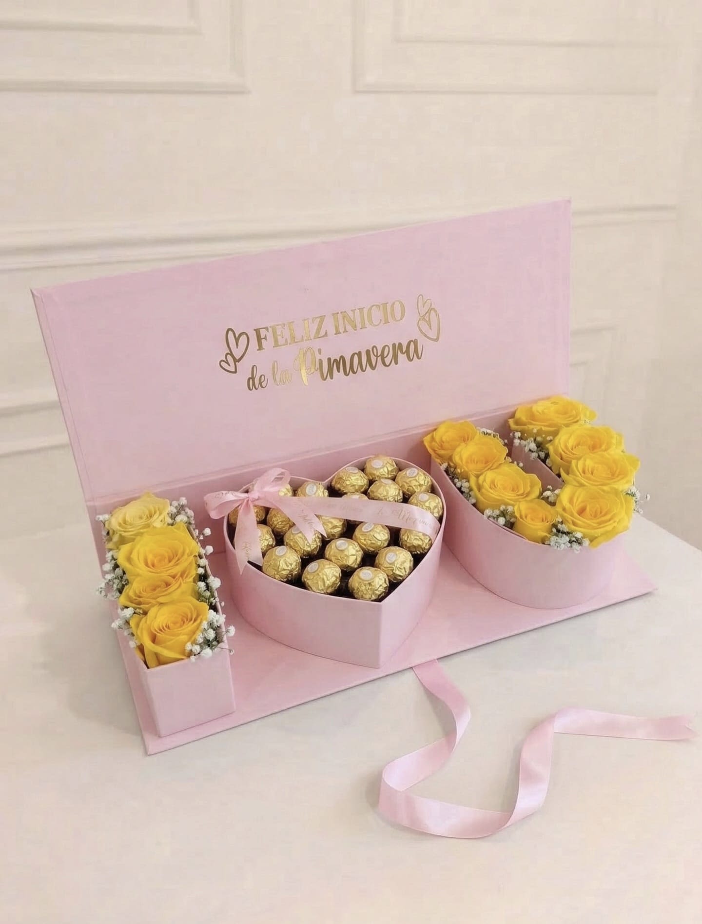 Pink gift box with yellow roses and chocolates