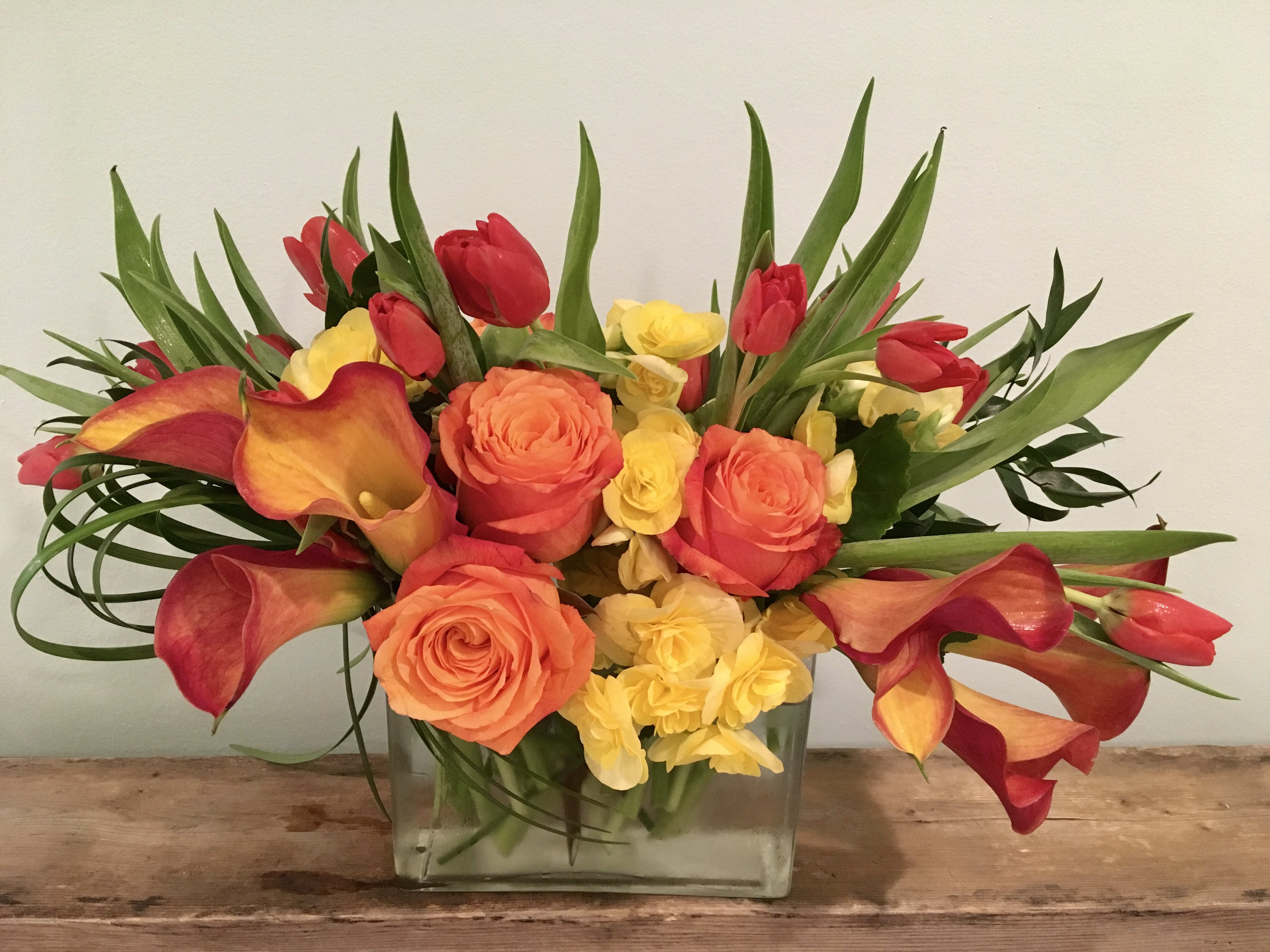 Naples Sunset - The Naples Florida sunsets are captured with a variety of flowers in a transitional design for any space.