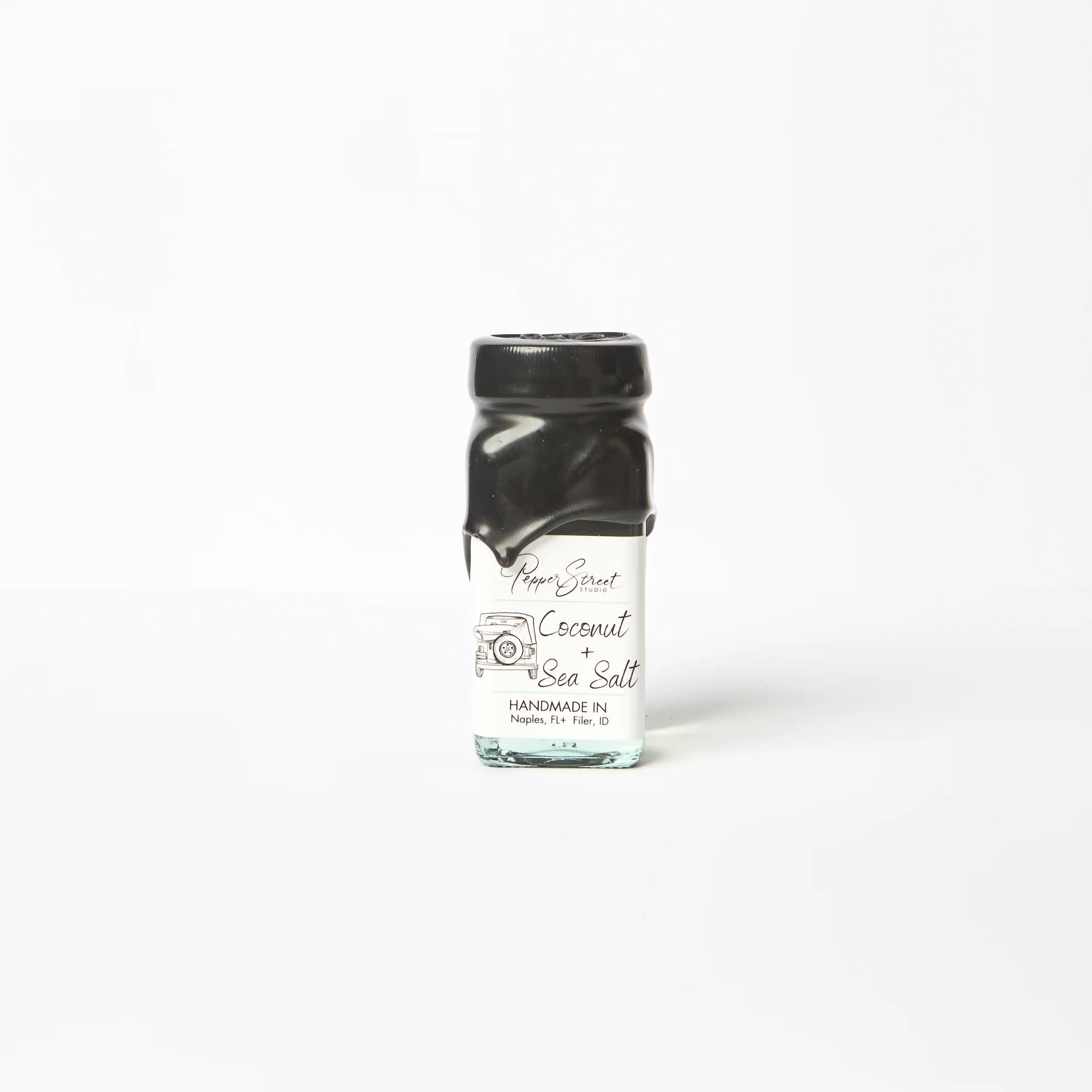 COCONUT + SEA SALT MINI ROOM DIFFUSER - Pepper Street's signature black wax and hand-dipped room diffuser, in a square glass bottle. It includes ten bamboo reeds for a sweet touch and effective scent diffusion. Their diffuser oils are wholly toxin-free and contain no additional alcohol, ensuring a long-lasting scent that will last you longer than eight months. A pull tab on the back allows easy access to the lid.  Bottle size: 4 fluid ounces Coconut + Sea Salt Experience a tropical paradise's rejuvenating and calming essence with the coconut and sea salt scent. The sweet and creamy notes of coconut harmoniously blend with the salty and briny scent of sea salt, transporting you to the beach. This refreshing and invigorating aroma is perfect for unwinding after a long day or during a spa day, leaving you feeling refreshed and relaxed. Indulge in the soothing fragrance and let it rejuvenate your mind and body. Linen gift bag included.