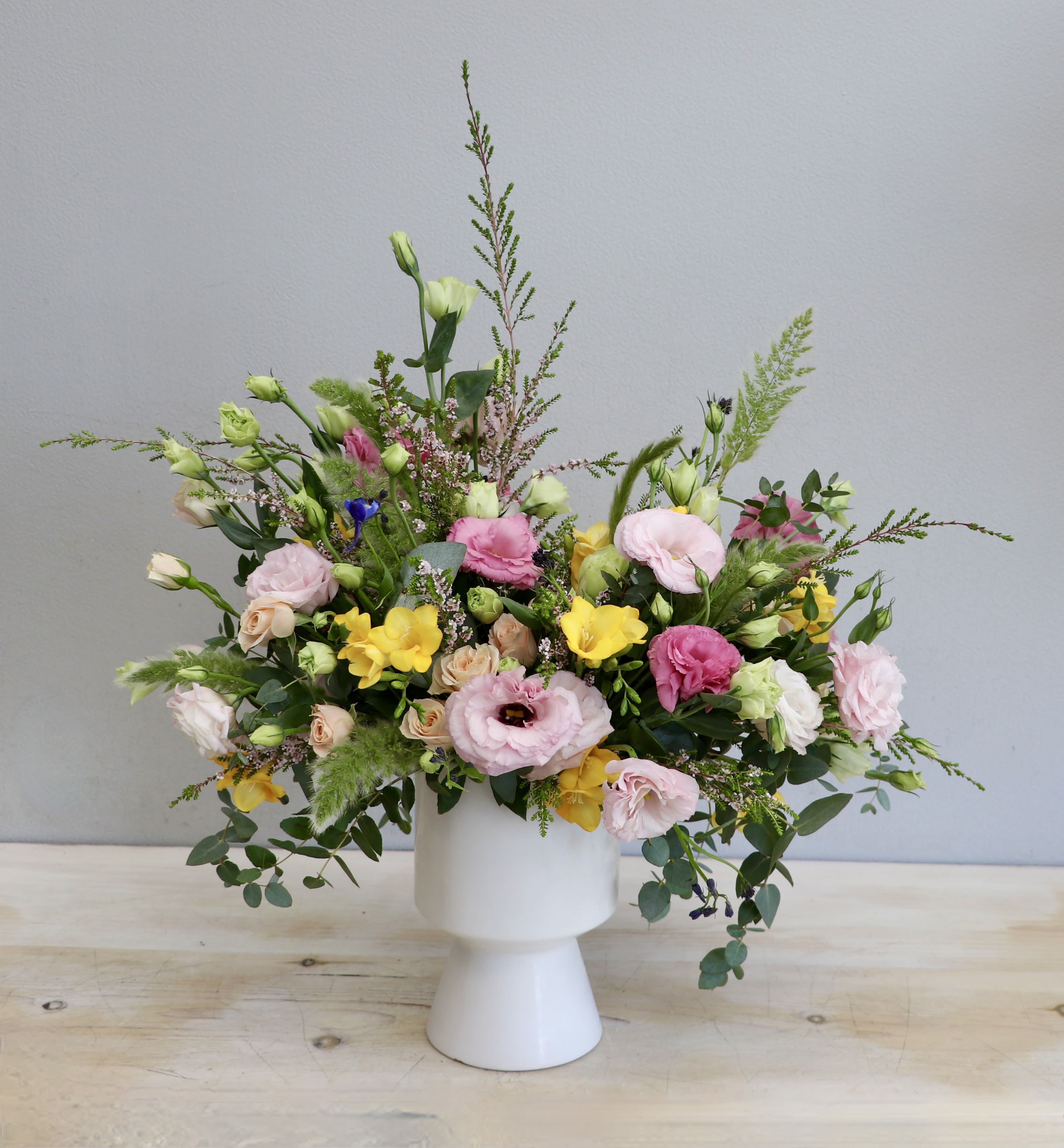 Blooming Spring - Glendale Flowers - New spring arrangement of soft pink, greens, and yellow. A lovely addition to any celebration.