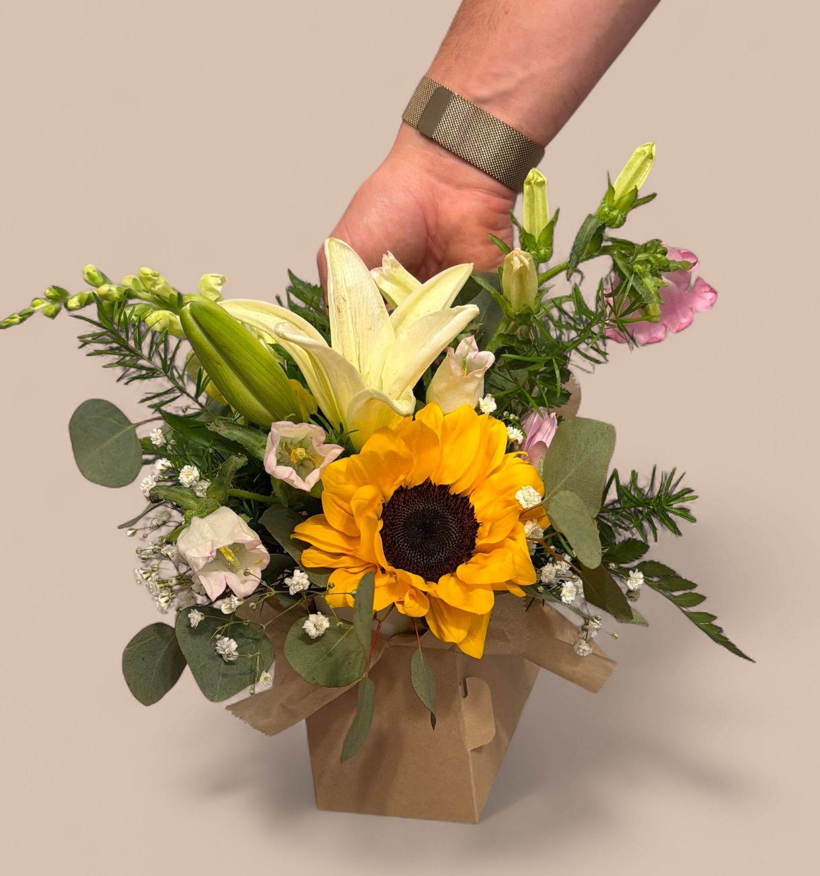 The Flower Carrier - Brighten a day (or yours) with our all-in-one gift carrier. Each sturdy carrier features a hand-crafted designer floral arrangement with a candle—the perfect way to say thank you or treat yourself. Perfect for our lovely school teachers!  