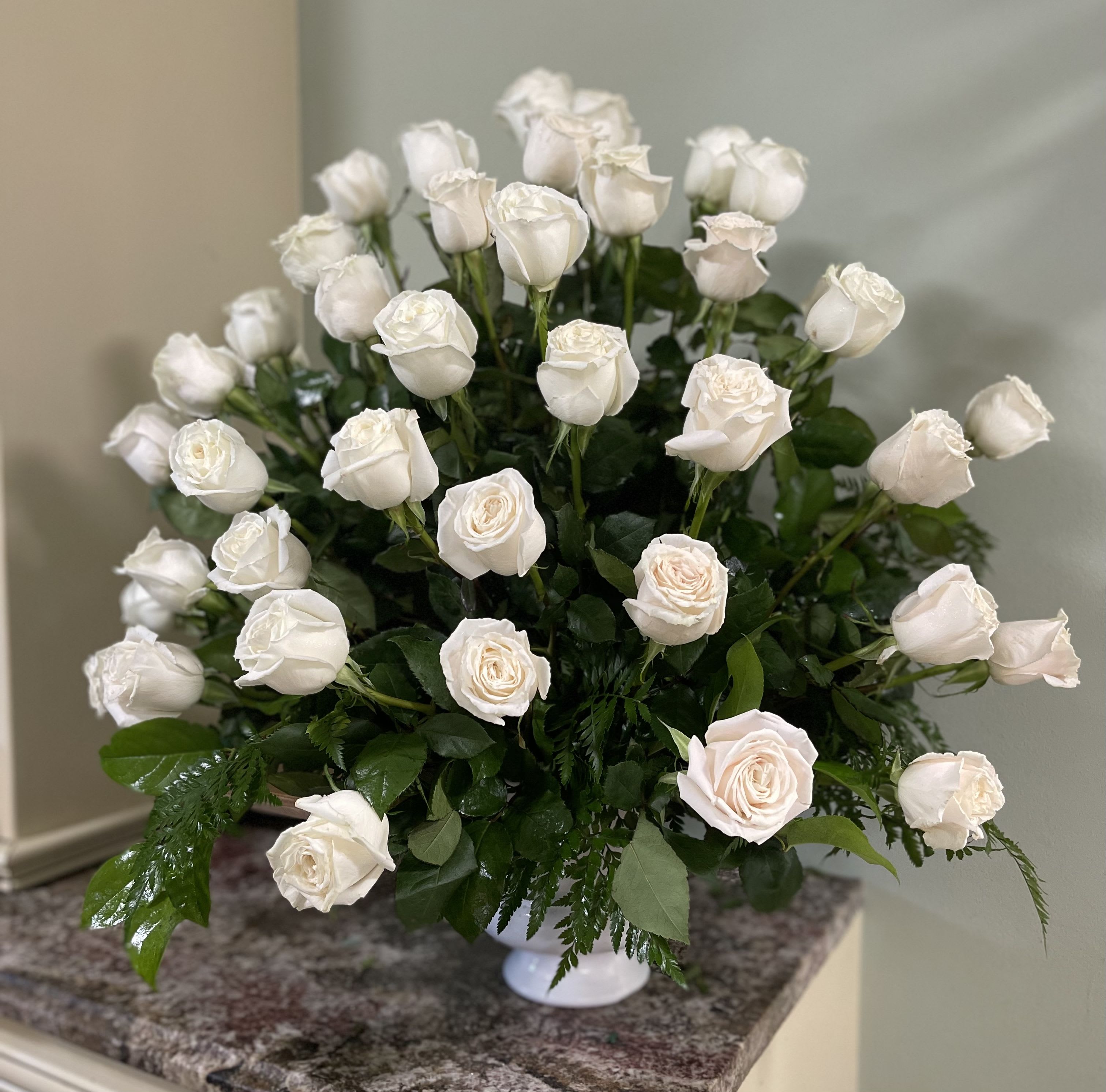 White rose bouquet in a white vase