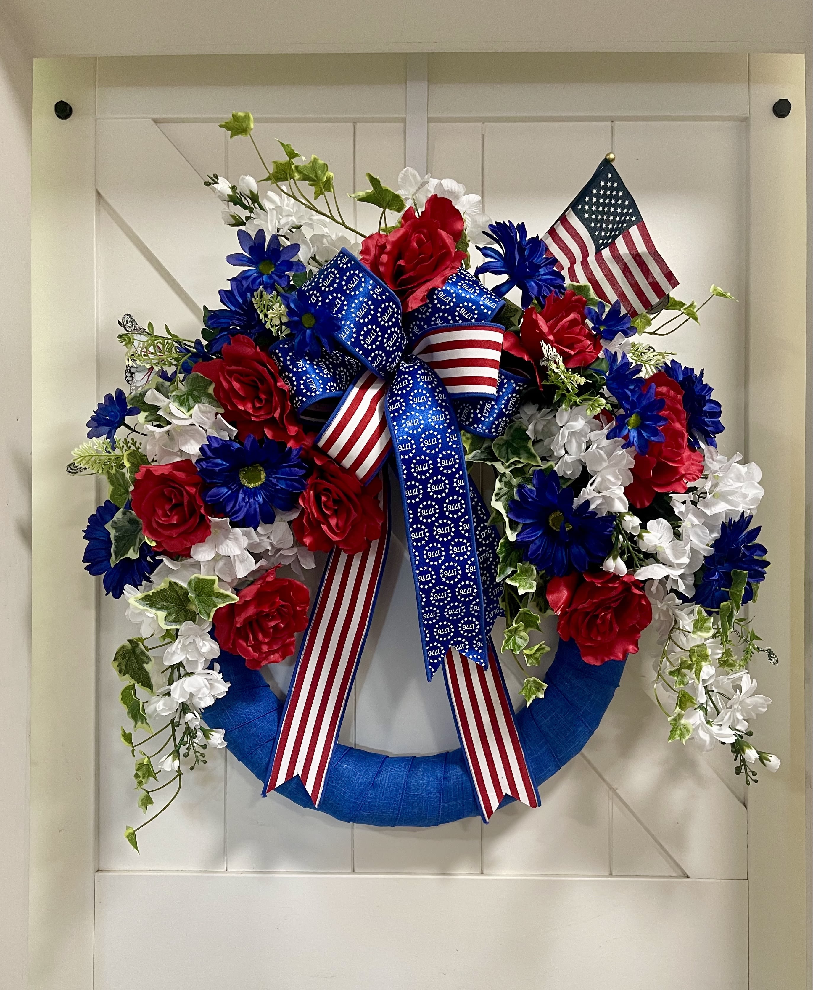 The Legacy 1776 Patriotic Wreath - As our nation prepares to celebrate America’s 250th Birthday, Legacy Florals &amp; Gifts is honored to help families, businesses, and communities decorate with patriotic pride. From custom wreaths and front porch displays to memorial tributes and event décor, each design is handcrafted to celebrate the values, sacrifices, and freedoms that make America special. This custom wreath is just one example of the unique patriotic creations we can design specifically for your home or business. ️ Proudly American  Custom Made  Designed with Patriotism and Purpose Let’s make America’s 250th celebration unforgettable!