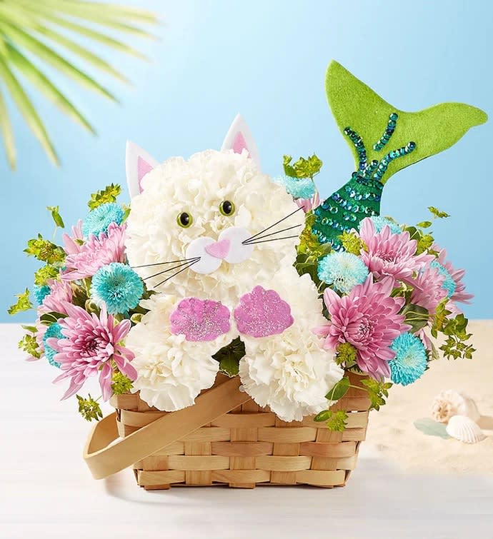 Cat-shaped floral basket with pink and blue flowers