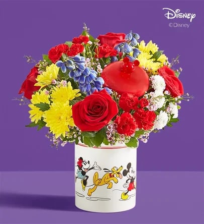 Colorful bouquet of roses, carnations, and daisies in a Disney-themed container