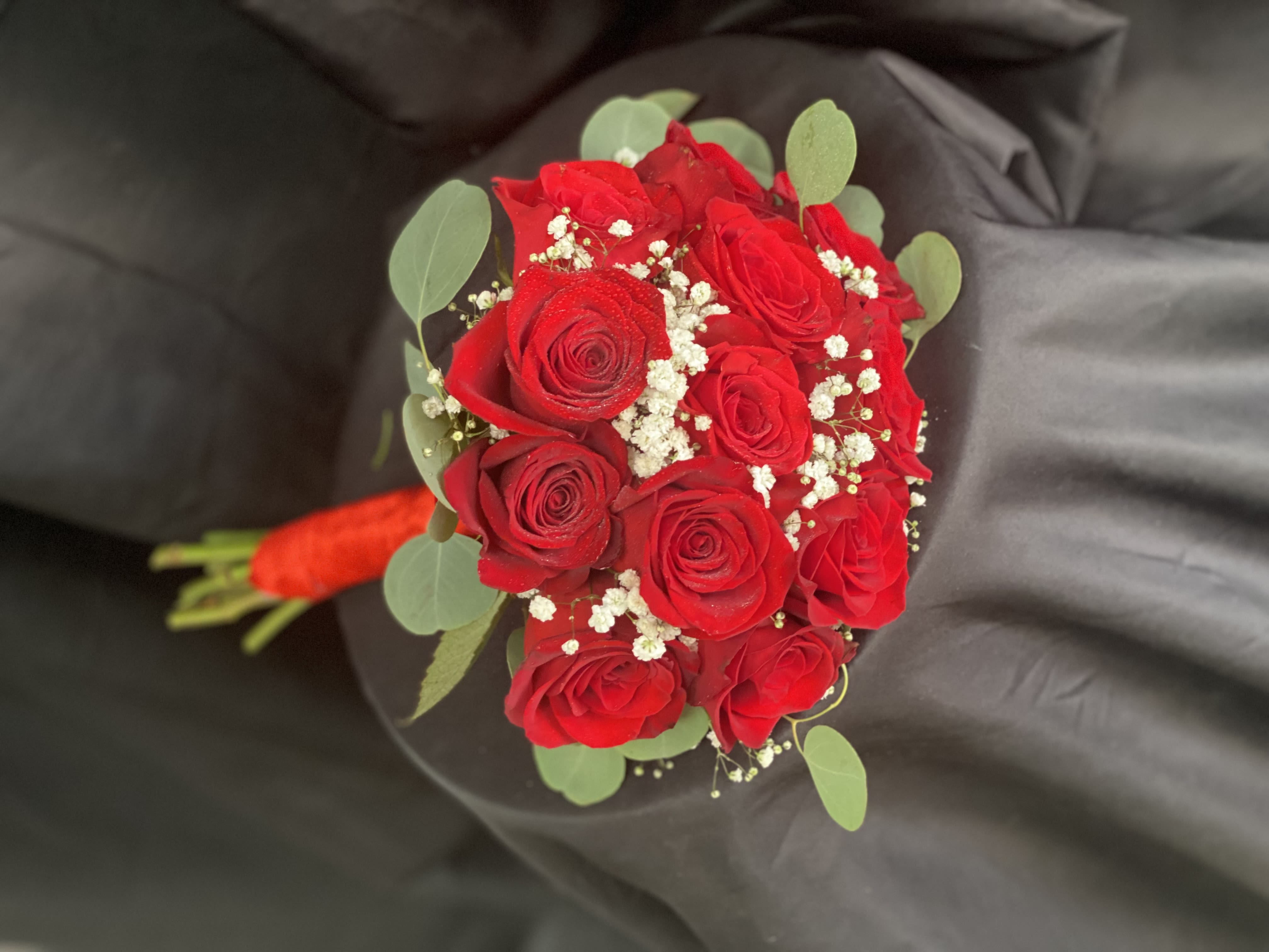 Bouquet of red roses with baby's breath and eucalyptus