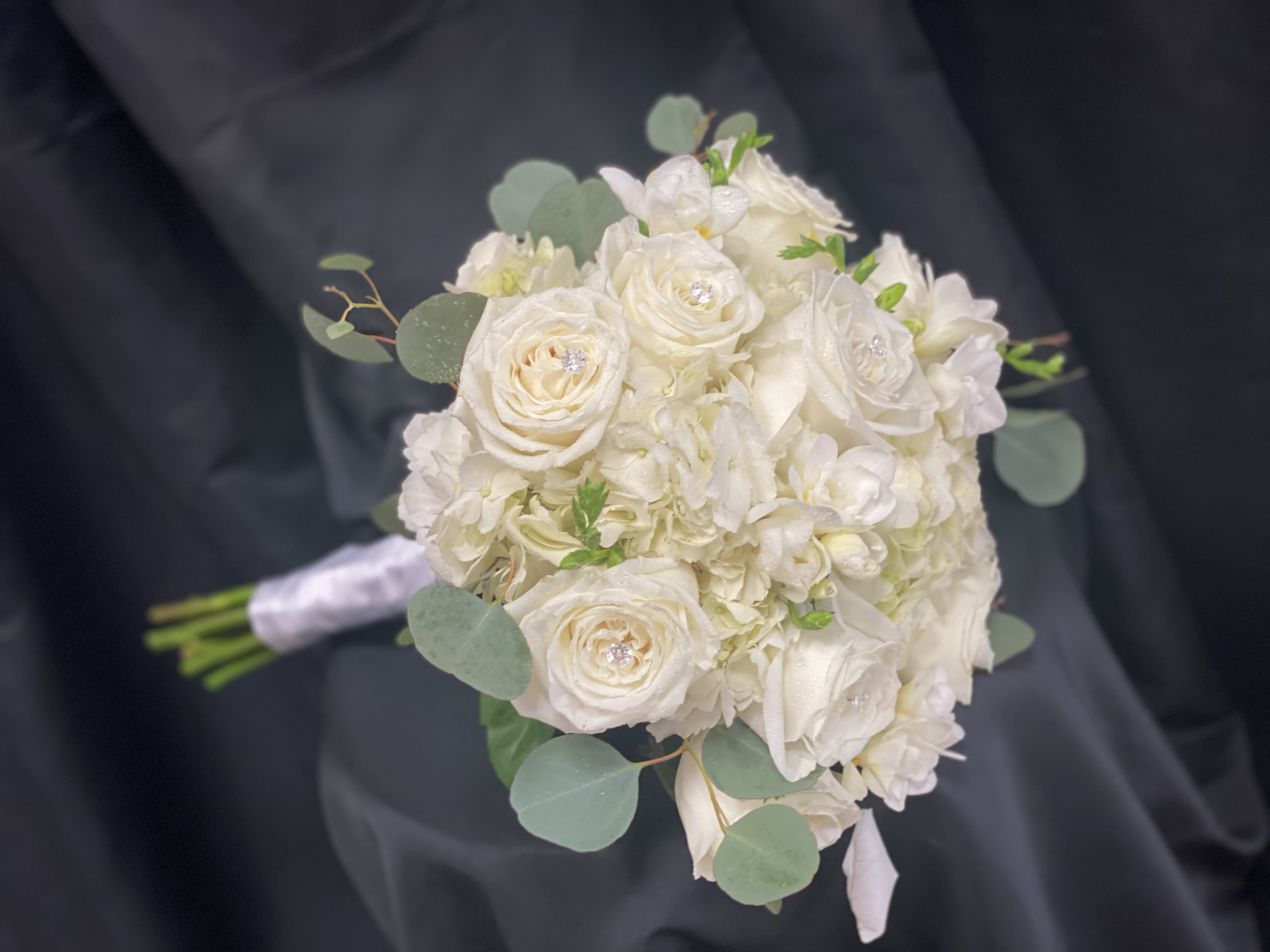 White rose and hydrangea bouquet with eucalyptus