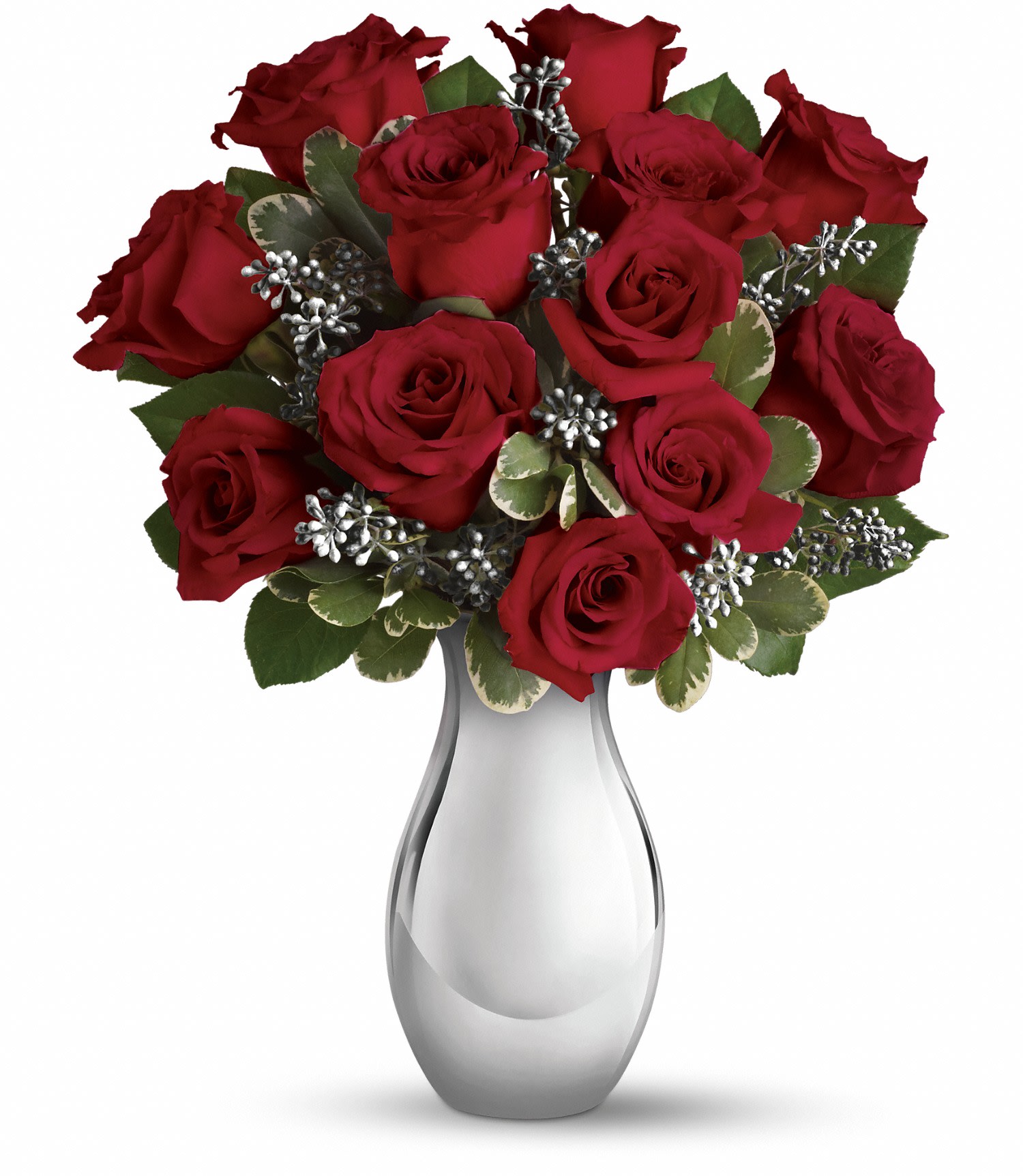 Red roses arranged in a clear glass vase