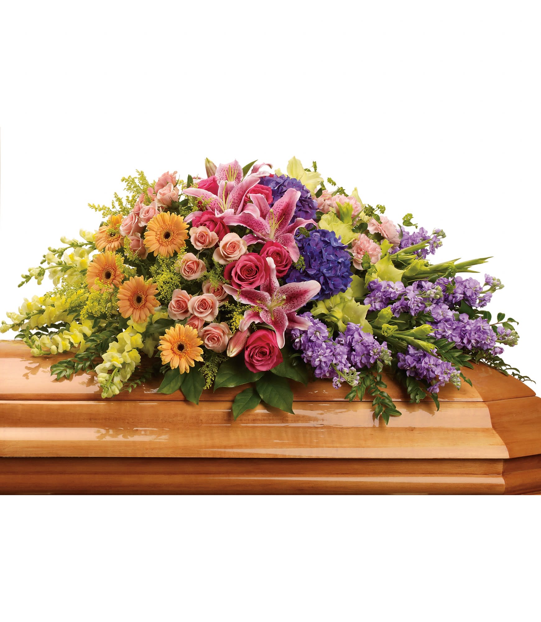 Colorful floral casket spray with lilies, roses, gerberas, and purple blooms