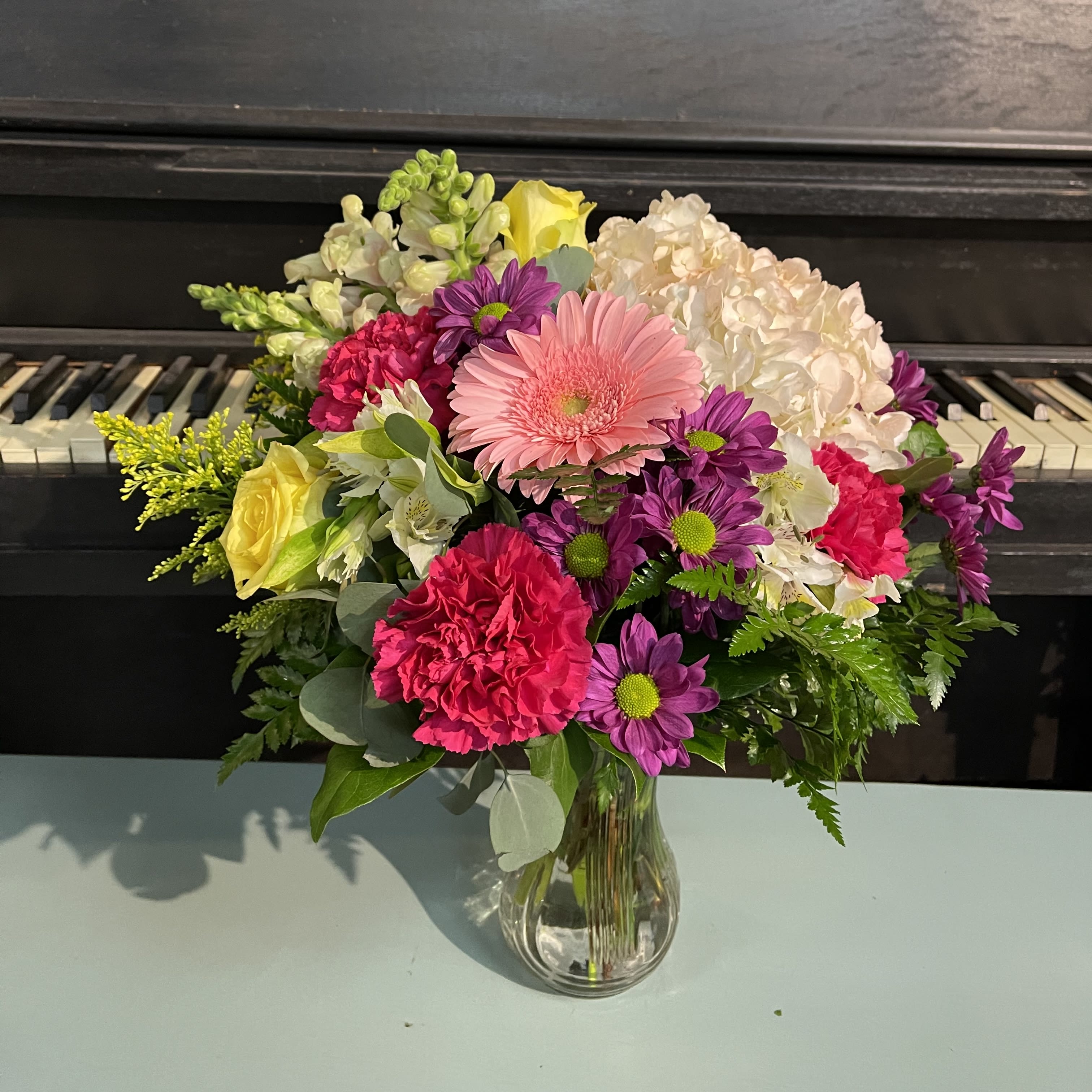 Designers Choice Mix Round  - A beautiful mixture of the freshest flower in a vase. A bright set up to brighten up your loved one. The arrangement in photo shows the size and variety of flowers that the arrangement will have. Colors WILL vary.  