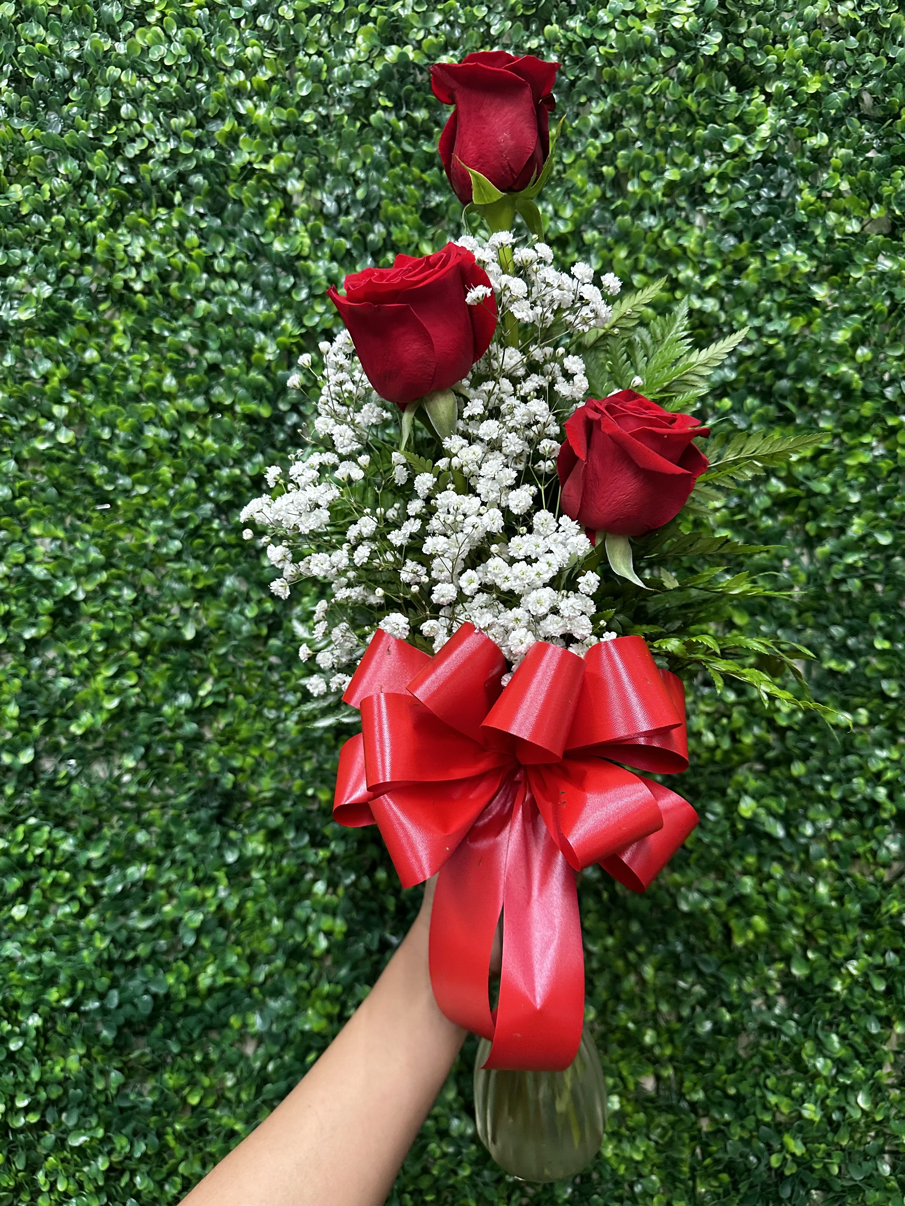 3 Rose Bud Vase  - Send out  3 roses arranged beautifully in a small bud vase. Long stem Red roses along with babies breath and greenery compliment each other perfectly. 