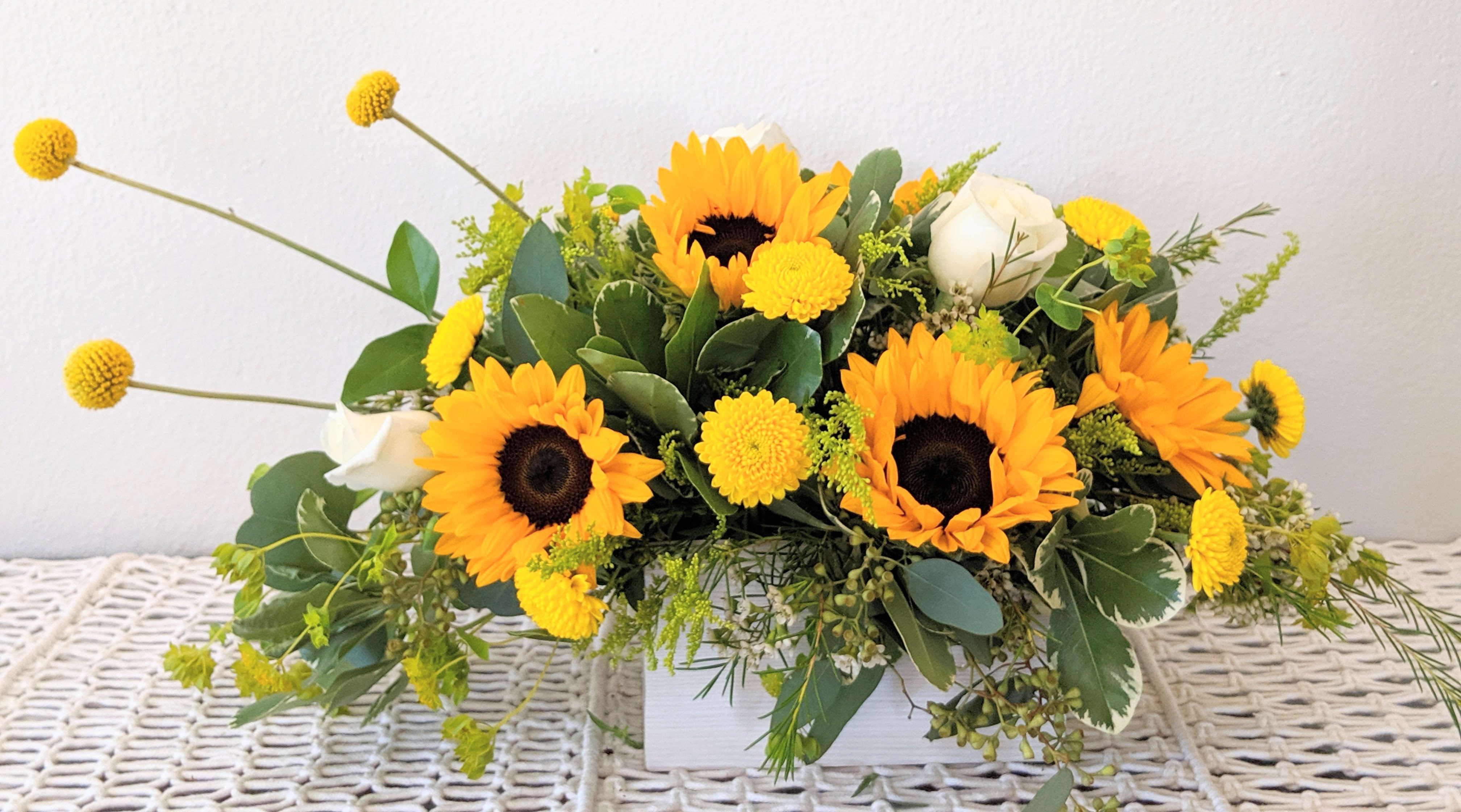 Sunny Day - This Sunny arrangement is full of sunshine and is sure to brighten anyone's day.