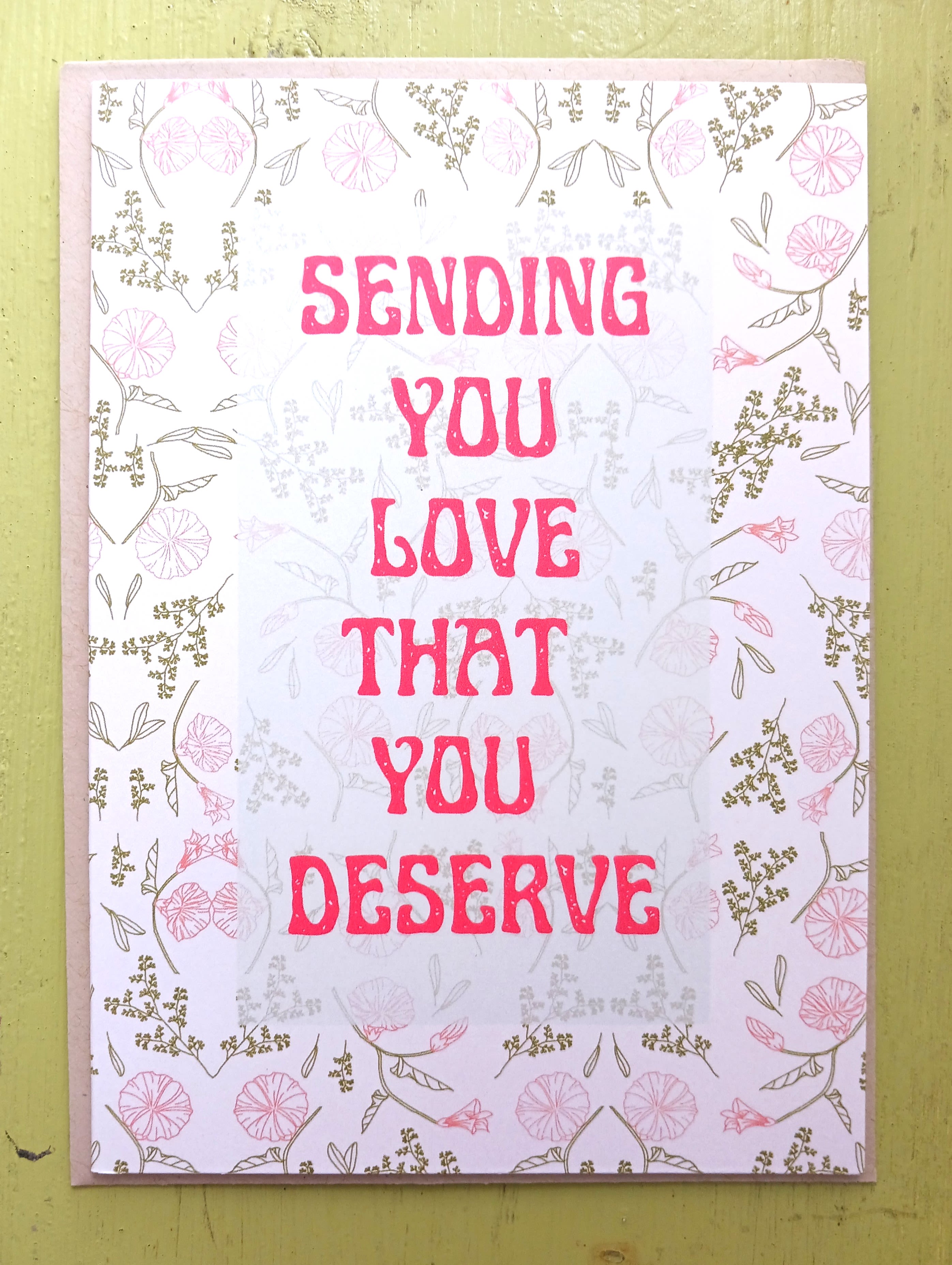 Pink and white greeting card with floral border and text sending you love that you deserve