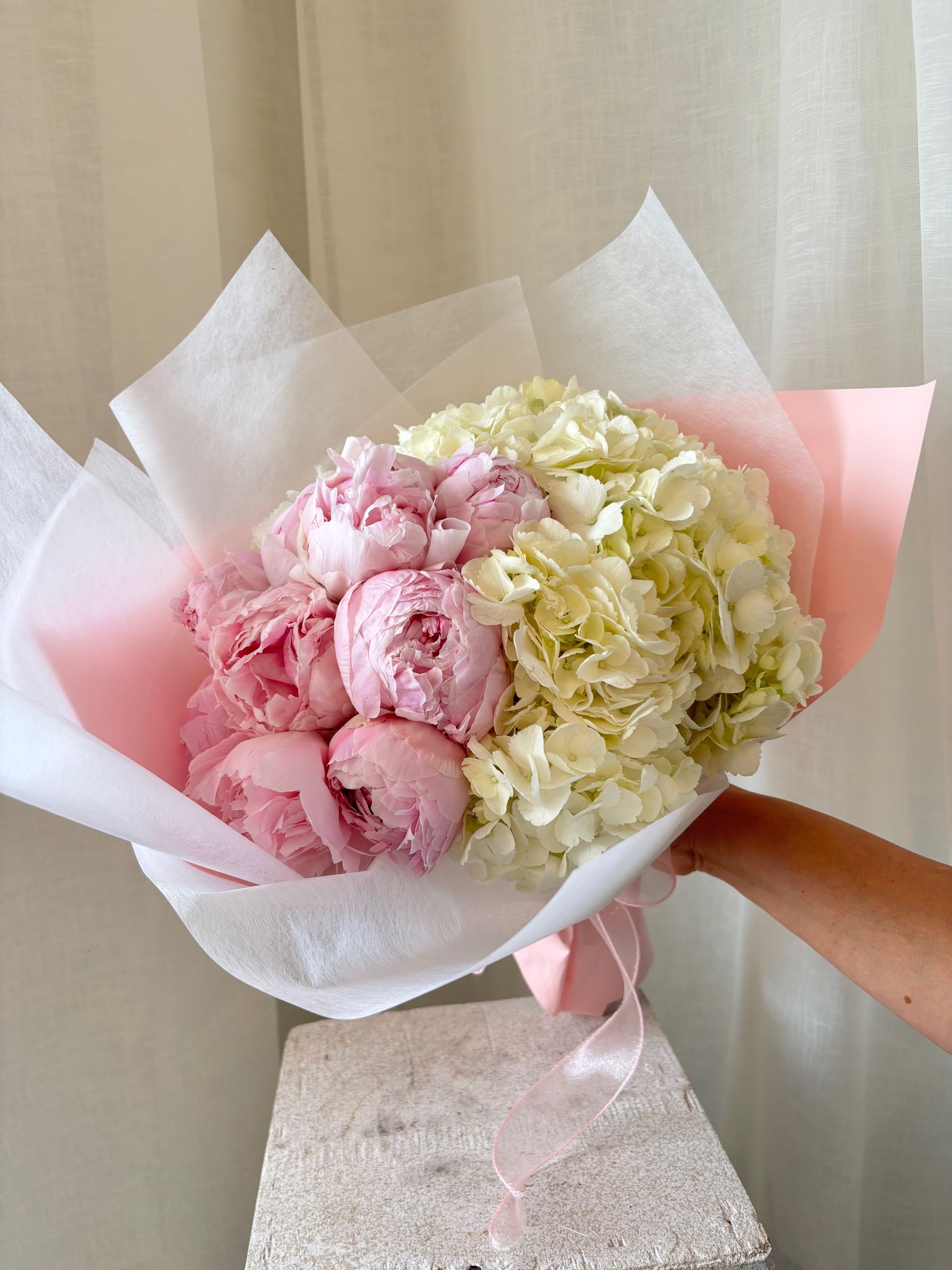 Peony Cloud - This simple yet impactful bouquet of 10 Peonies (standard) nestled in a cloud of Hydrangeas will be sure to impress anyone! 