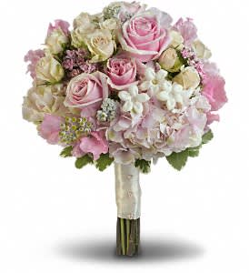 Pink Rose Splendor Bouquet - A wonderfully wide variety of soft pink and white blooms make this fragrant bouquet fabulously feminine.  Sensational stems of pink hydrangea, light pink roses, crème roses, pink sweet pea, pink bouvardia, stephanotis and dusty miller are contrasted against variegated pittosporum.  Approximately 11" W x 13 1/2" H  Orientation: N/A 