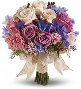 Country Rose Bouquet - Dusty lavenders, soft mauves and creamy whites create a charming, country-inspired bouquet.  Pink bouvardia, lavender hydrangea, lavender and crème roses, pink limonium, pink lisianthus and lavender sweet pea with red hypericum.  Approximately 12 1/2" W x 14" H  Orientation: N/A