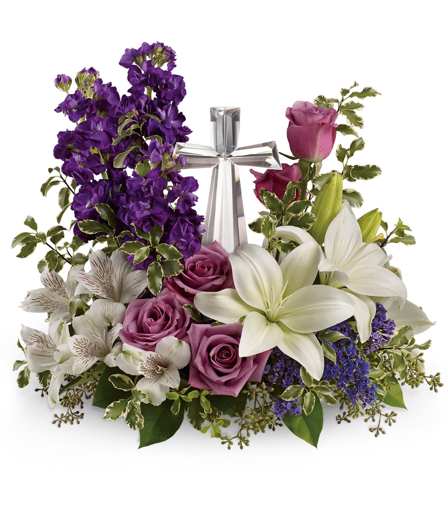 Purple and white floral arrangement with roses and lilies around a silver cross