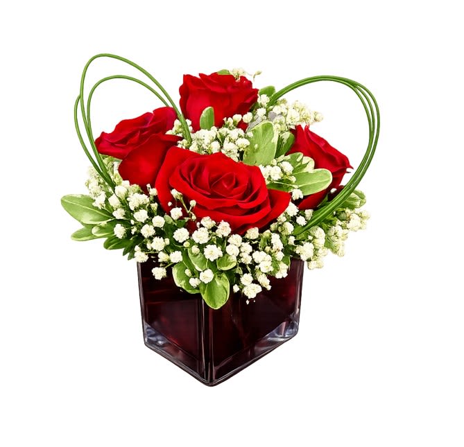 Teleflora's Sweet Thoughts Bouquet with Red Roses - If you'd like someone to think sweet thoughts about you, send them this delightful bouquet! A graceful heart of bear grass with red roses nestled in a ruby-red glass cube. How sweet it is! 