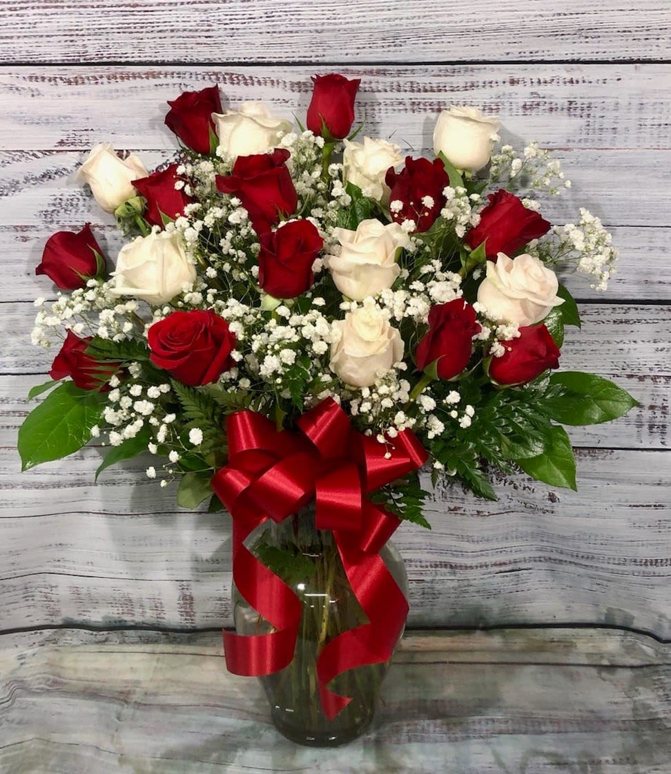 Love's Divine Bouquet - Long Stemmed Roses - Love's divine, and roses are too. At almost two feet tall, this beautiful mix of red and white roses - accented with Queen Anne's Lace or Gypsophila, and adorned with a bold red ribbon - is a timeless gift for your beloved.  Red and white roses accented with Queen Anne's lace and more are delivered in a glass vase accented with a red satin ribbon.  Approximately 18" W x 23" H  Orientation: All-Around      As Shown : T11Z101A     Deluxe : T11Z101B     Premium : T11Z101C  