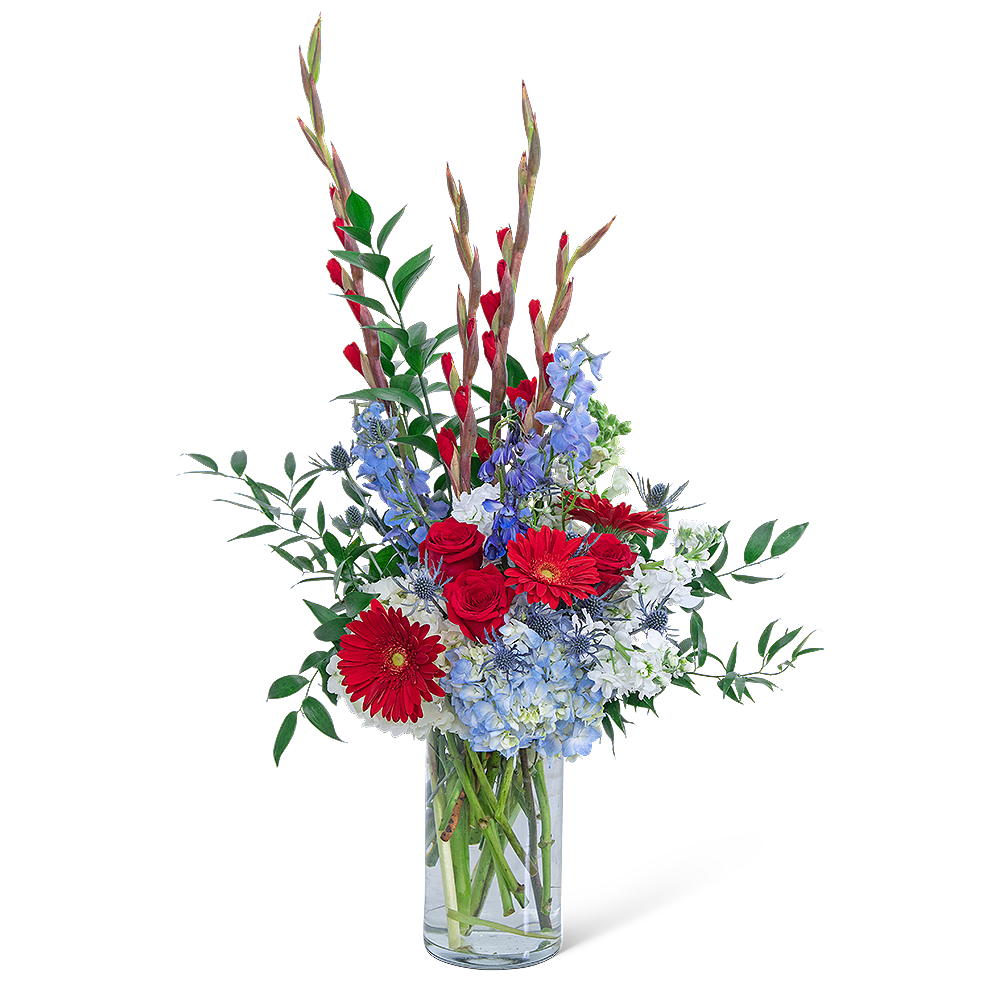 Red and blue mixed bouquet in a clear glass vase