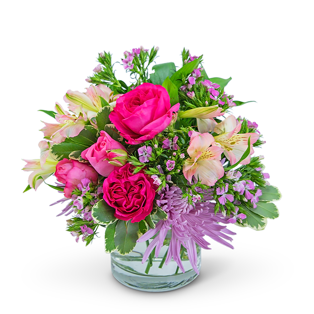 Pink roses and lilies in a clear glass vase