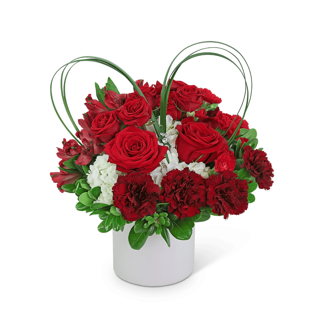 Beating Heart - Beating Heart is a very romantic gift! This fresh flower design is created with roses, alstroemeria, and carnations in a white vase. Whether you're looking for a gift for your Valentine or just to show someone how much you care, this design made up of red and white blossoms with a natural foliage heart accent makes it an exceptional gift for Valentine's Day. Whether you're looking for a gift for your Valentine or just to show someone how much you care, this romantic bouquet will surely convey your feelings.