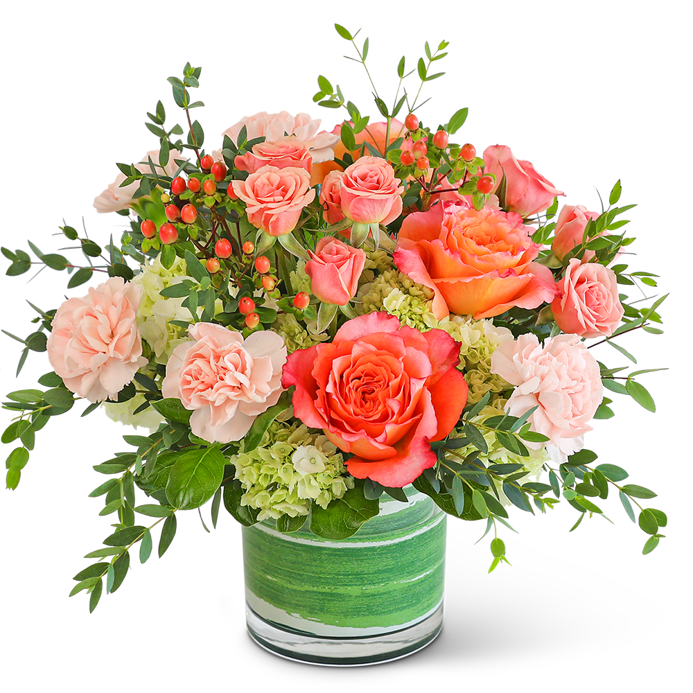 Coral roses and pale carnations in a green-striped glass vase