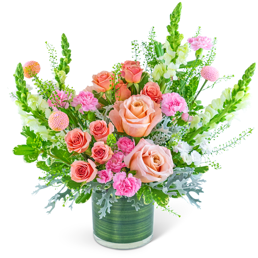 Peach and pink roses in a green glass vase