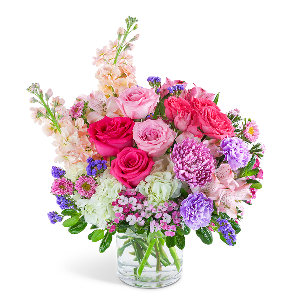 Pink and purple mixed flower bouquet in a clear glass vase