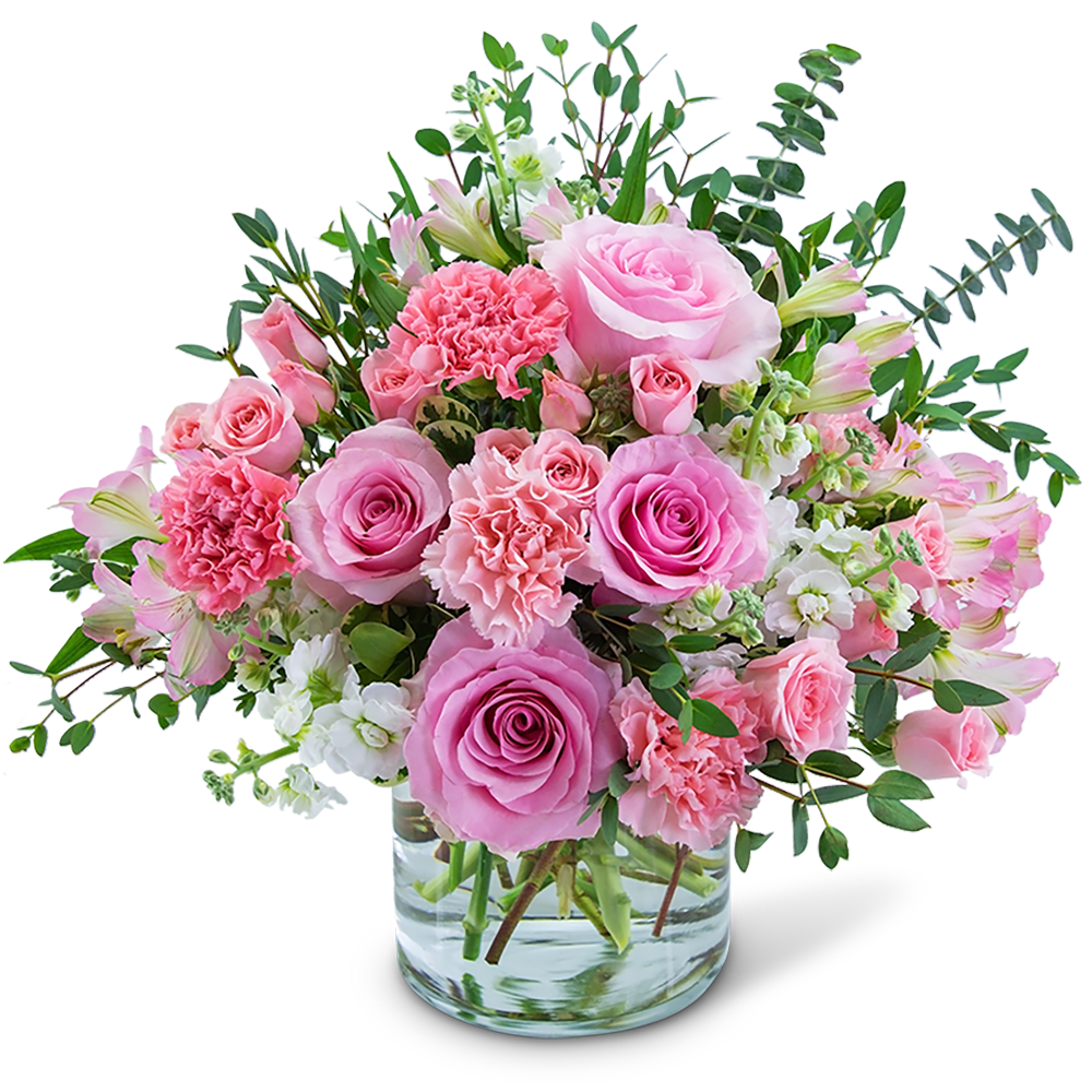 Pink roses and carnations in a clear glass vase