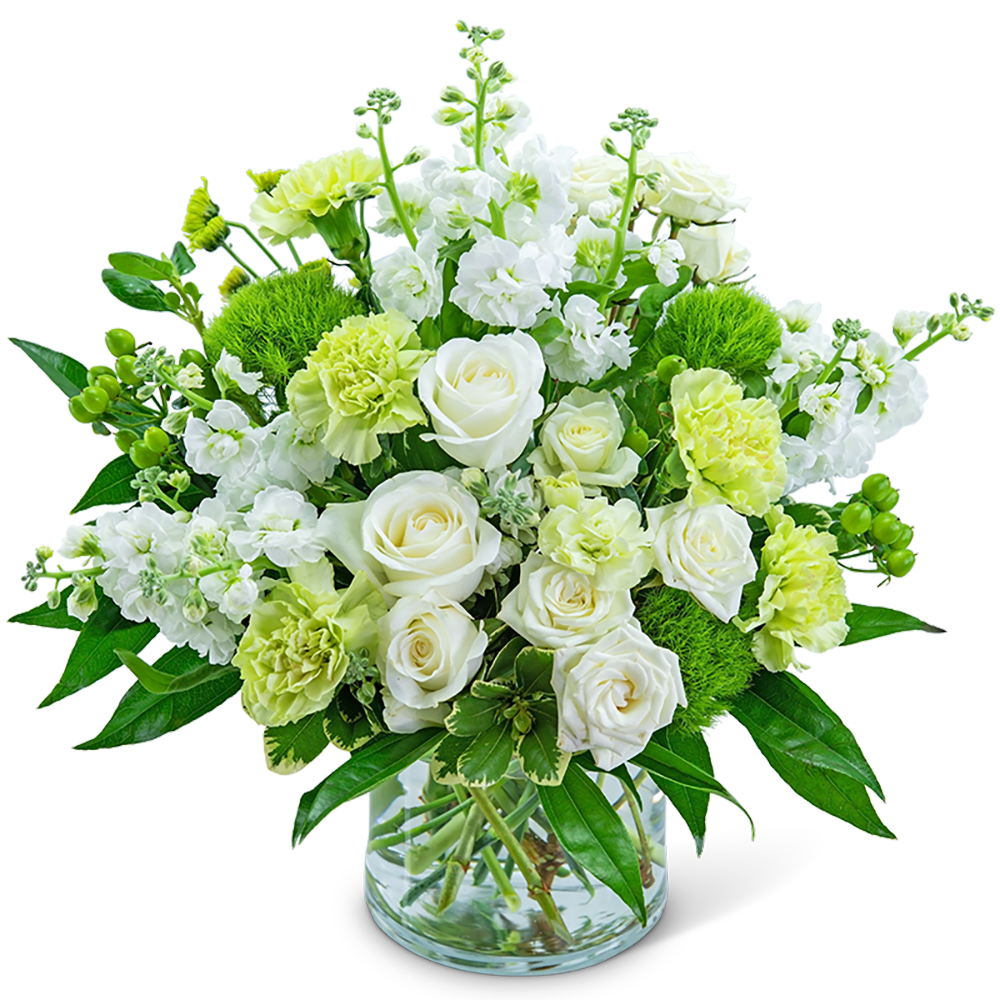 White and pale green floral arrangement in a clear glass vase