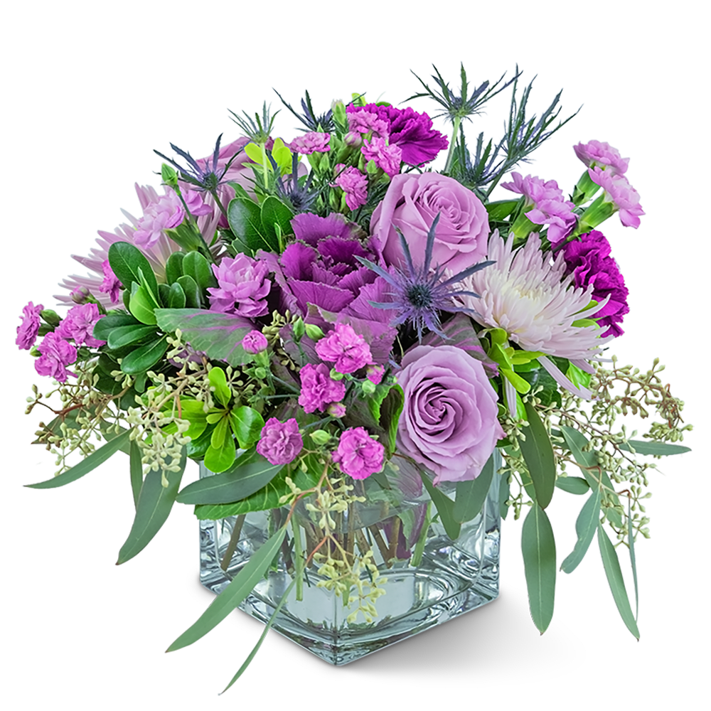 Amethyst Prism - This jewel of an arrangement will brighten anyone’s day! Amethyst Prism contains roses, spider mums, kale, carnations, and dianthus accented with a variety of foliage. What a great way to make your home or office sparkle! 