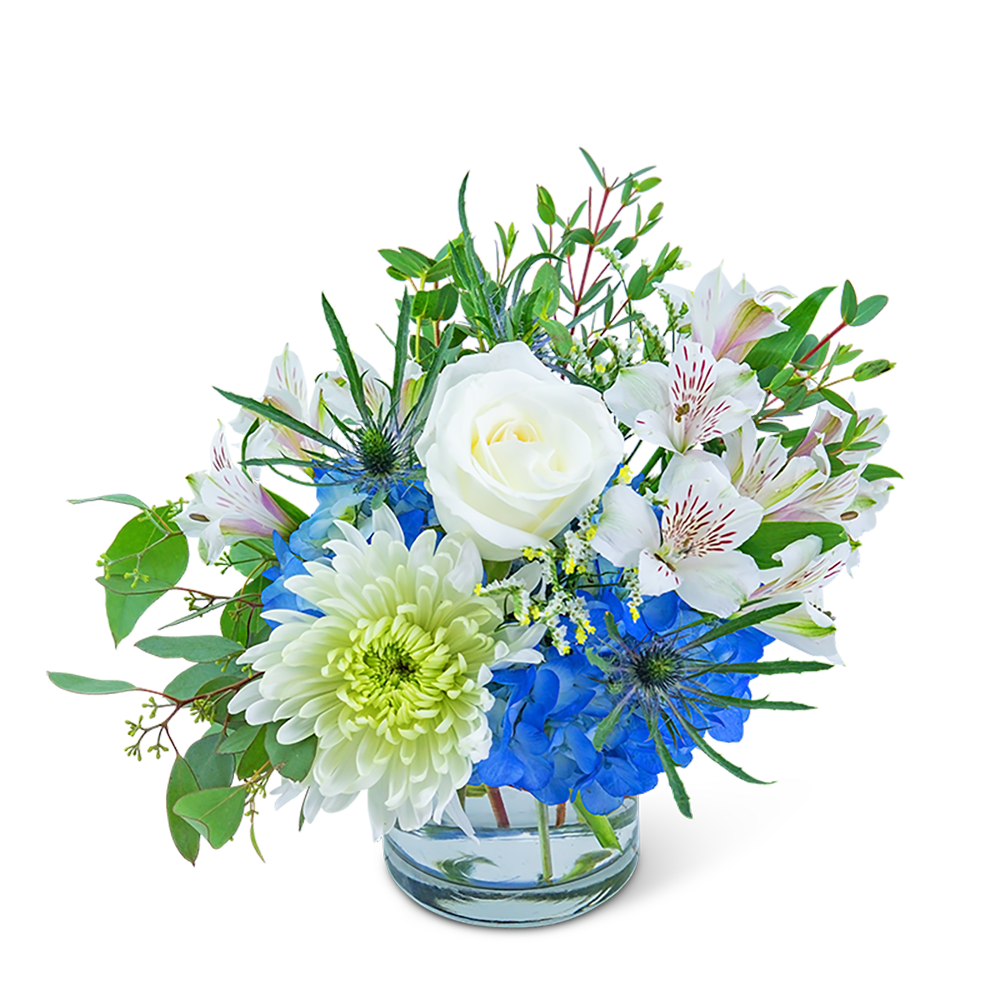 Blue and white mixed bouquet in a clear glass vase