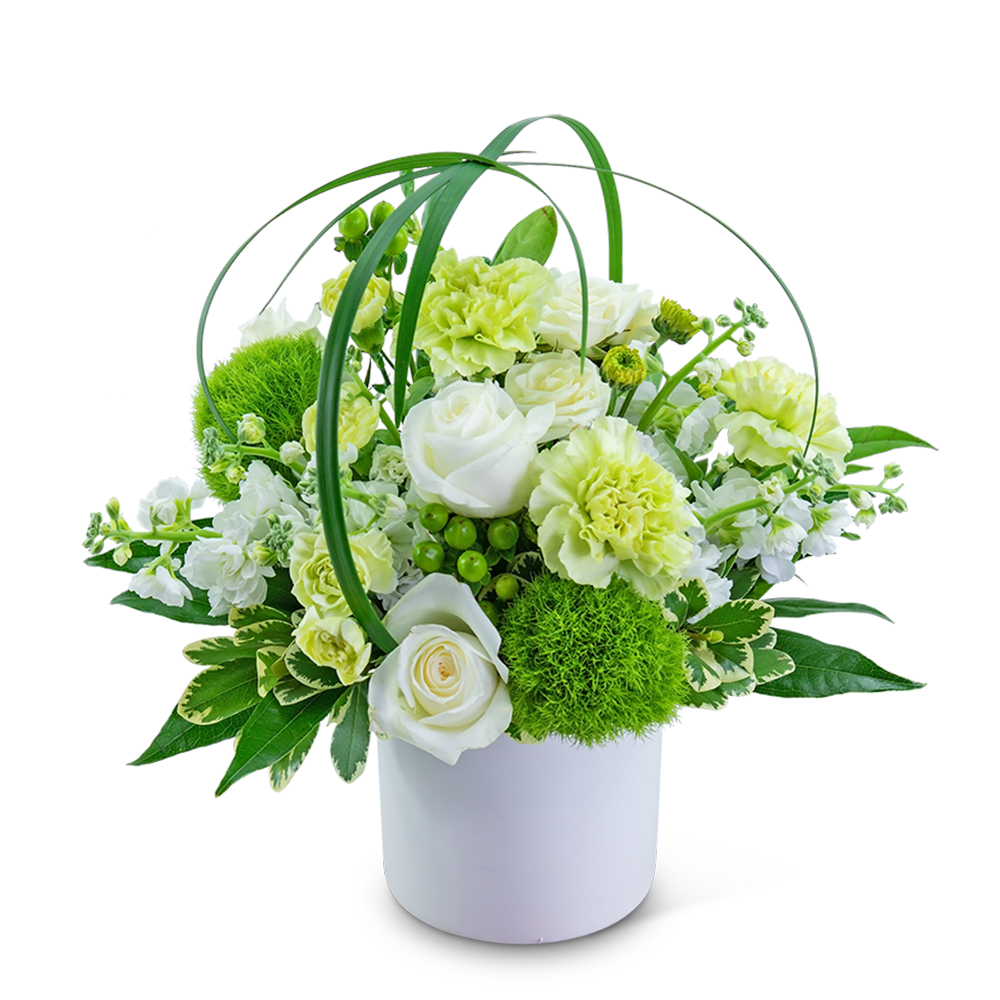 White and pale green floral arrangement in a white bucket