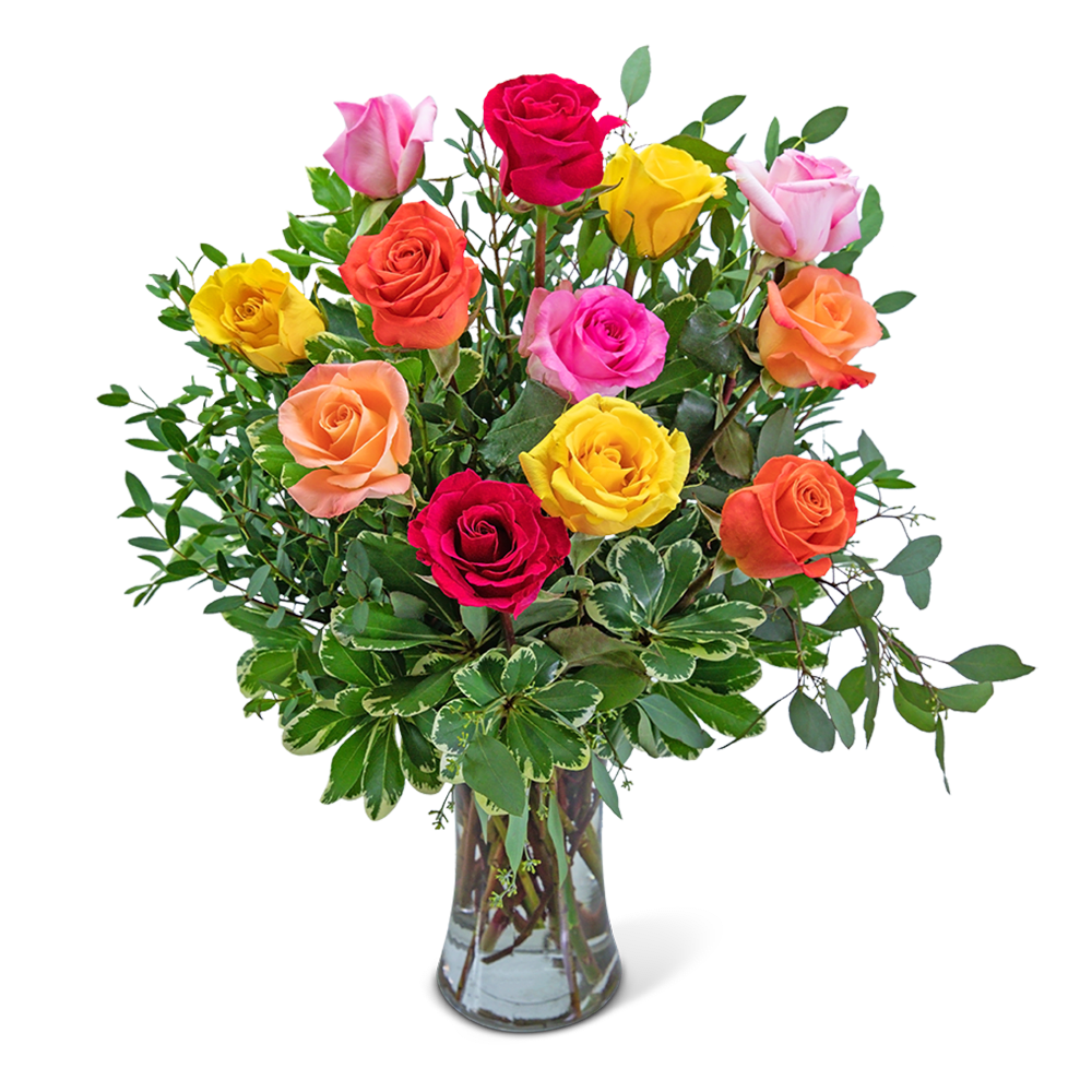 Mixed-color roses arranged in a clear glass vase