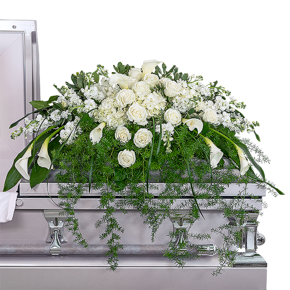 Eternal Peace Casket Spray - Our Eternal Peace Casket Spray features white calla lilies, stock, hydrangea, and roses, along with premium foliage. The casket spray is typically provided by the spouse or immediate family as a heartfelt memorial from the family. All white sympathy arrangements are classic and beautiful, allowing you to demonstrate the purity of your love and respect for your loved one. Funeral flowers bring healing to the family and friends of a lost loved one.