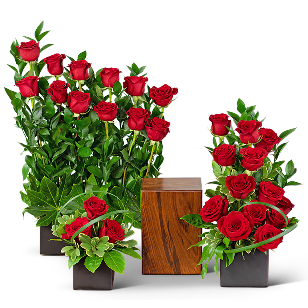 Red roses arranged in black square vases with a wooden cube centerpiece