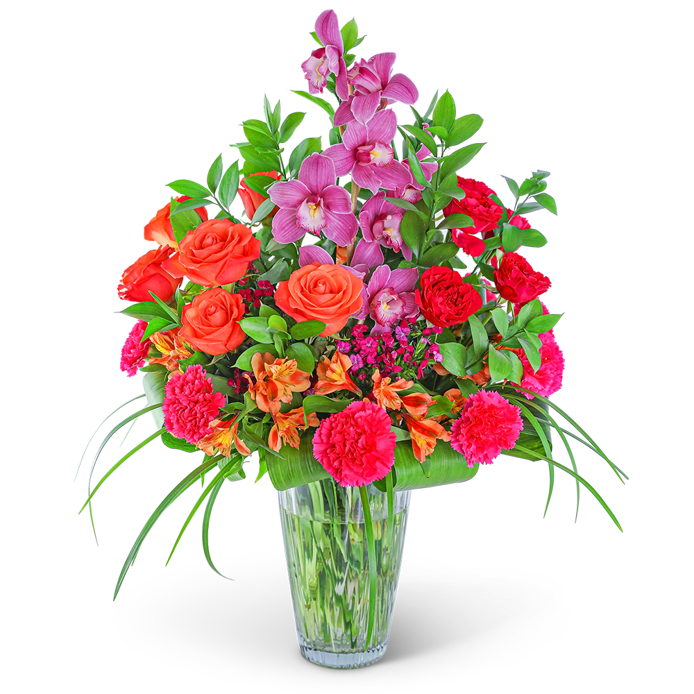 Mixed bouquet of pink orchids, orange roses, and red carnations in a glass vase