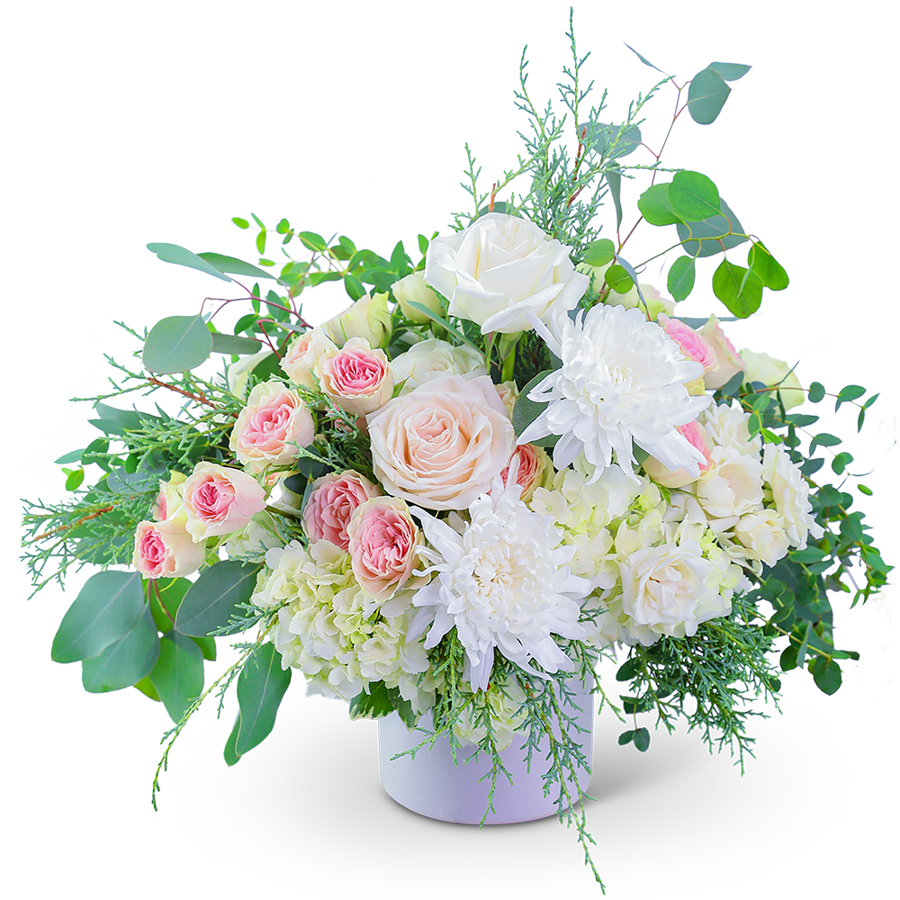 Fairytale Frost - Awaken the senses as you walk into your own romantic floral fairytale! Traditional roses, contemporary mums, and playful hydrangea mix to create a stunning bouquet! Fairytale Frost is bursting with blossoms and arranged in an eye-catching white ceramic vase, accented with premium foliage. A staff favorite, this timeless beauty is perfect for any occasion!