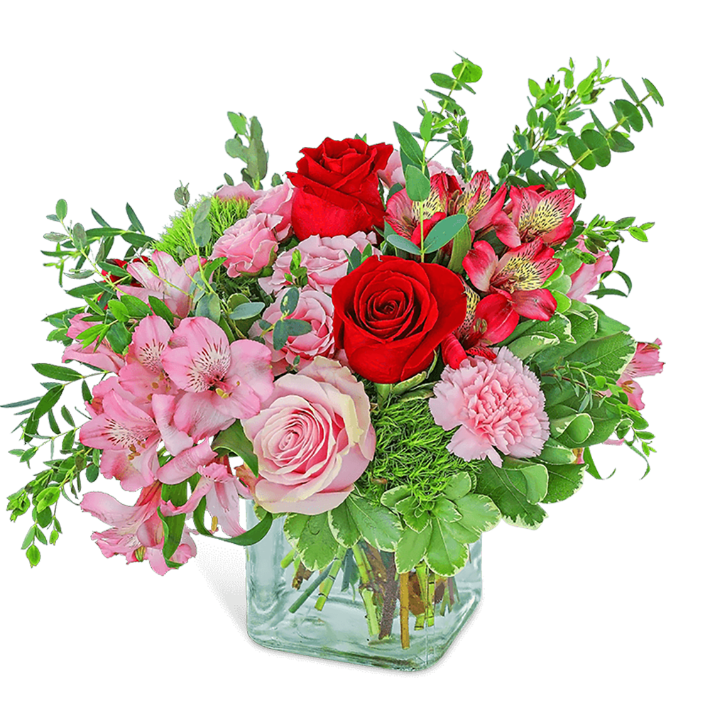 Pink and red mixed bouquet in a clear glass vase
