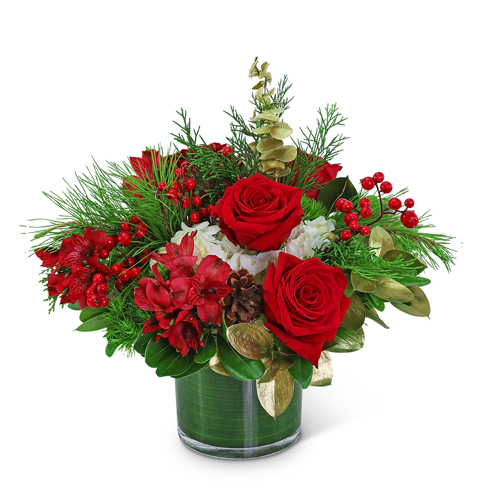 Red roses and red flowers in a glass vase with pine and berries