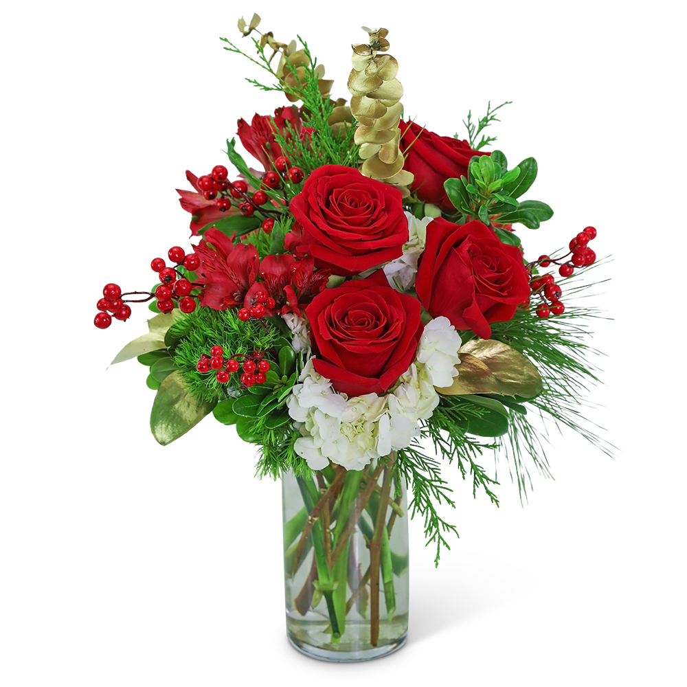 Red roses and white flowers in a clear glass vase