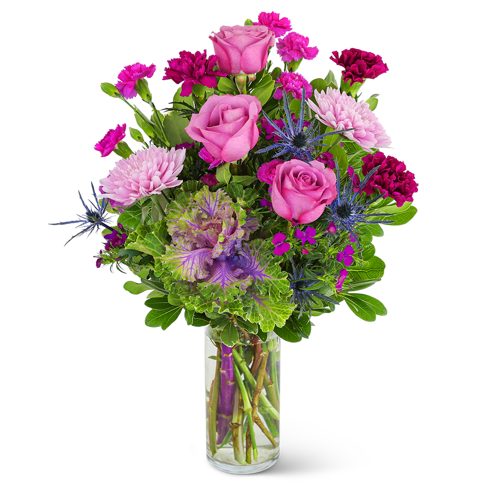 Pink roses and purple flowers in a clear glass vase