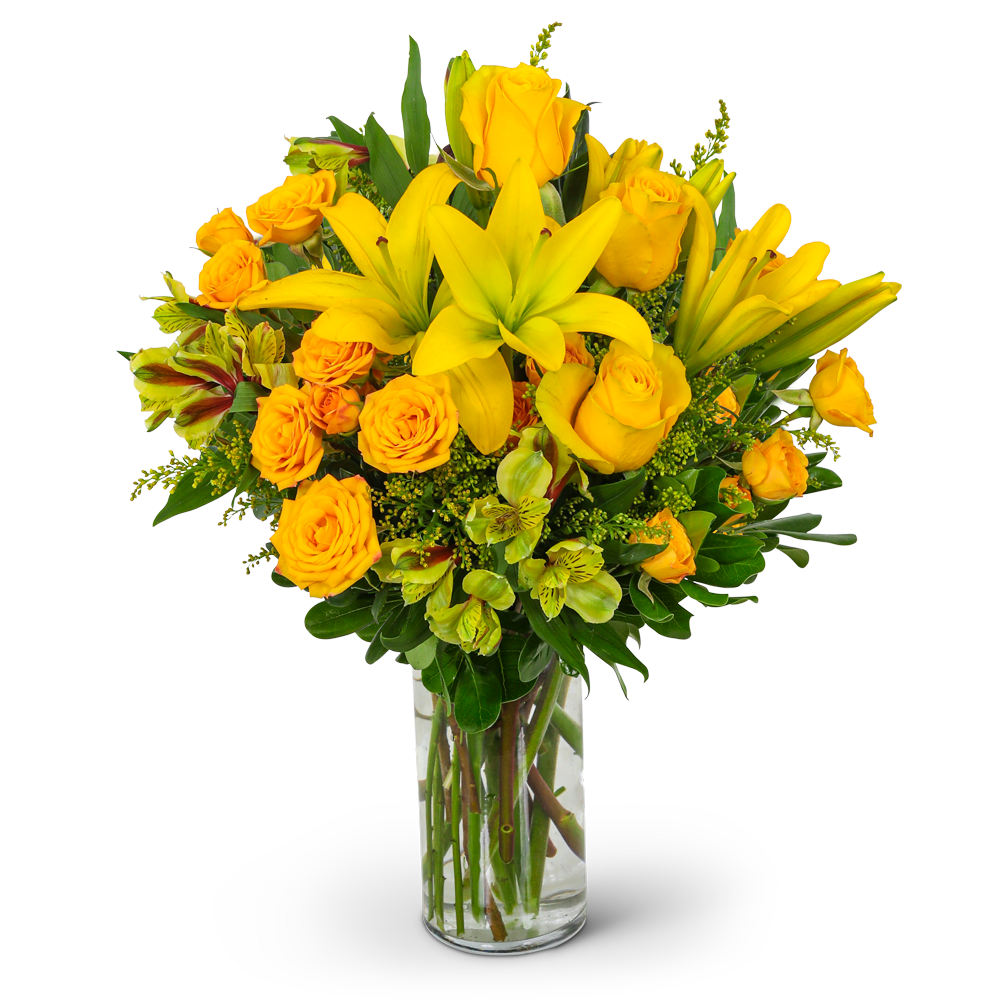 Yellow roses and lilies in a clear glass vase